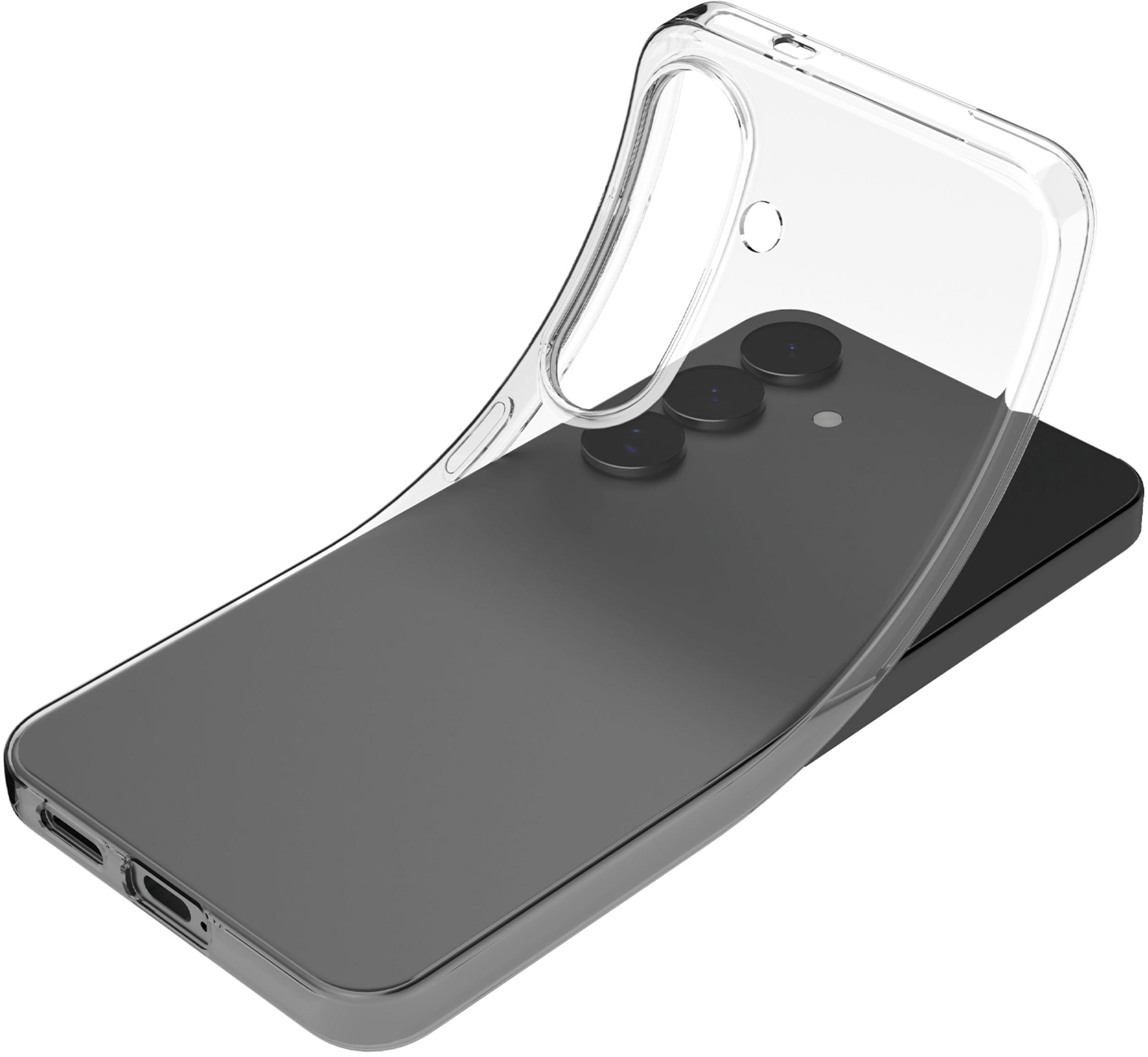 Una cover trasparente per telefono giace su uno smartphone scuro.
