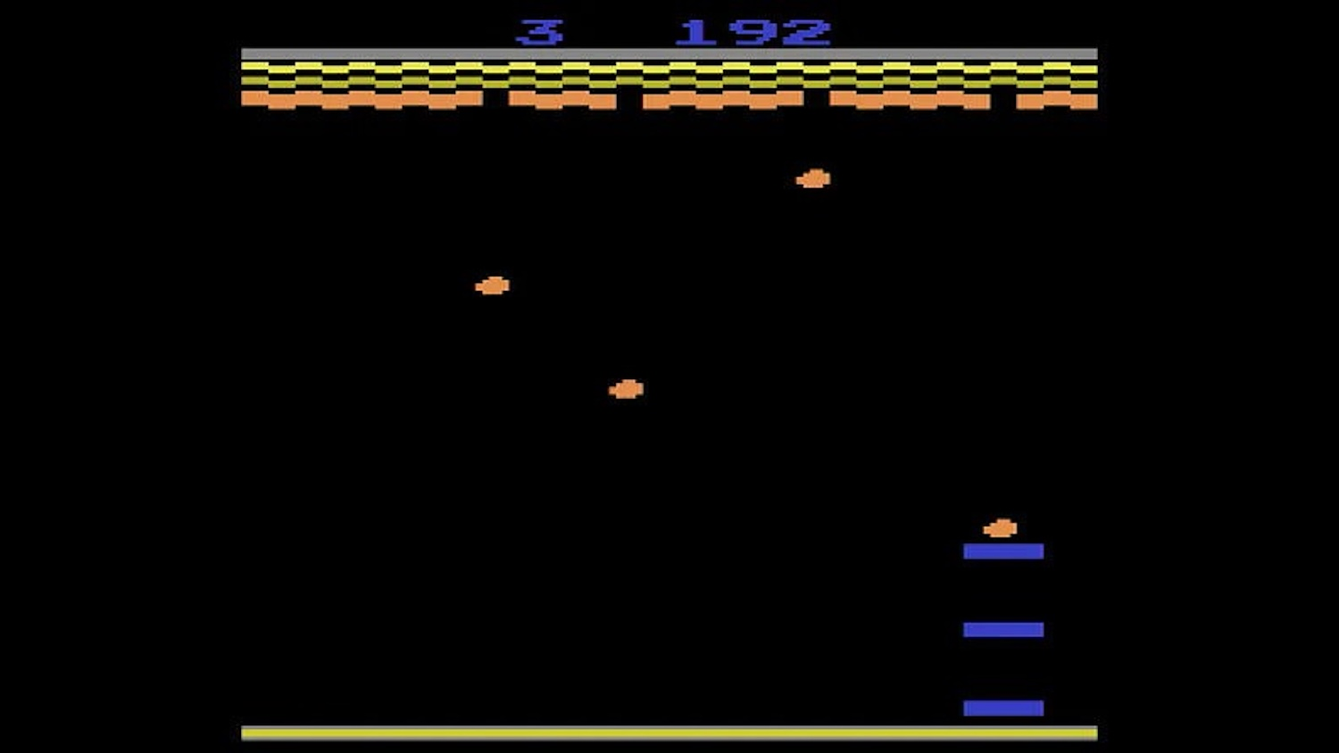 Un videogioco retrò con punti arancioni su sfondo nero, punteggio 3 192.