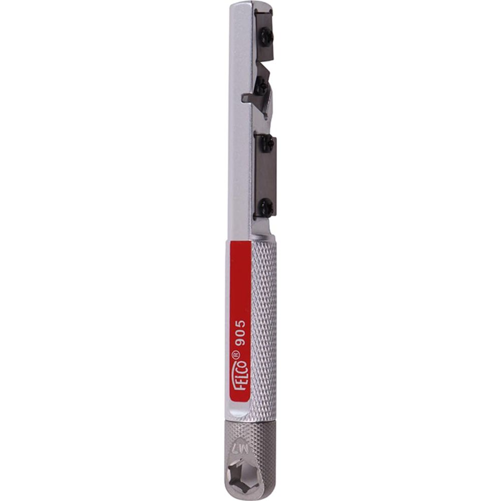 Silbernes Werkzeug mit rotem Band und Gravur FELCO 905. Metallgriff.