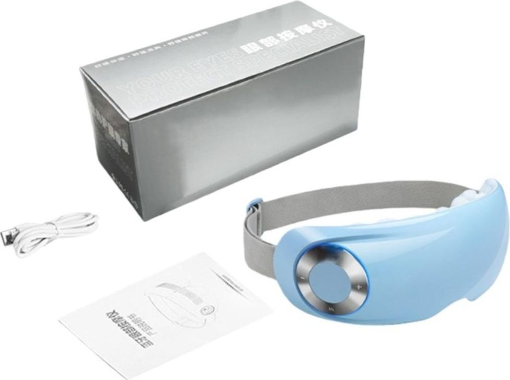 Ein blaues Augenmassagegerät mit Ladekabel und Anleitung neben einer silbernen Box.