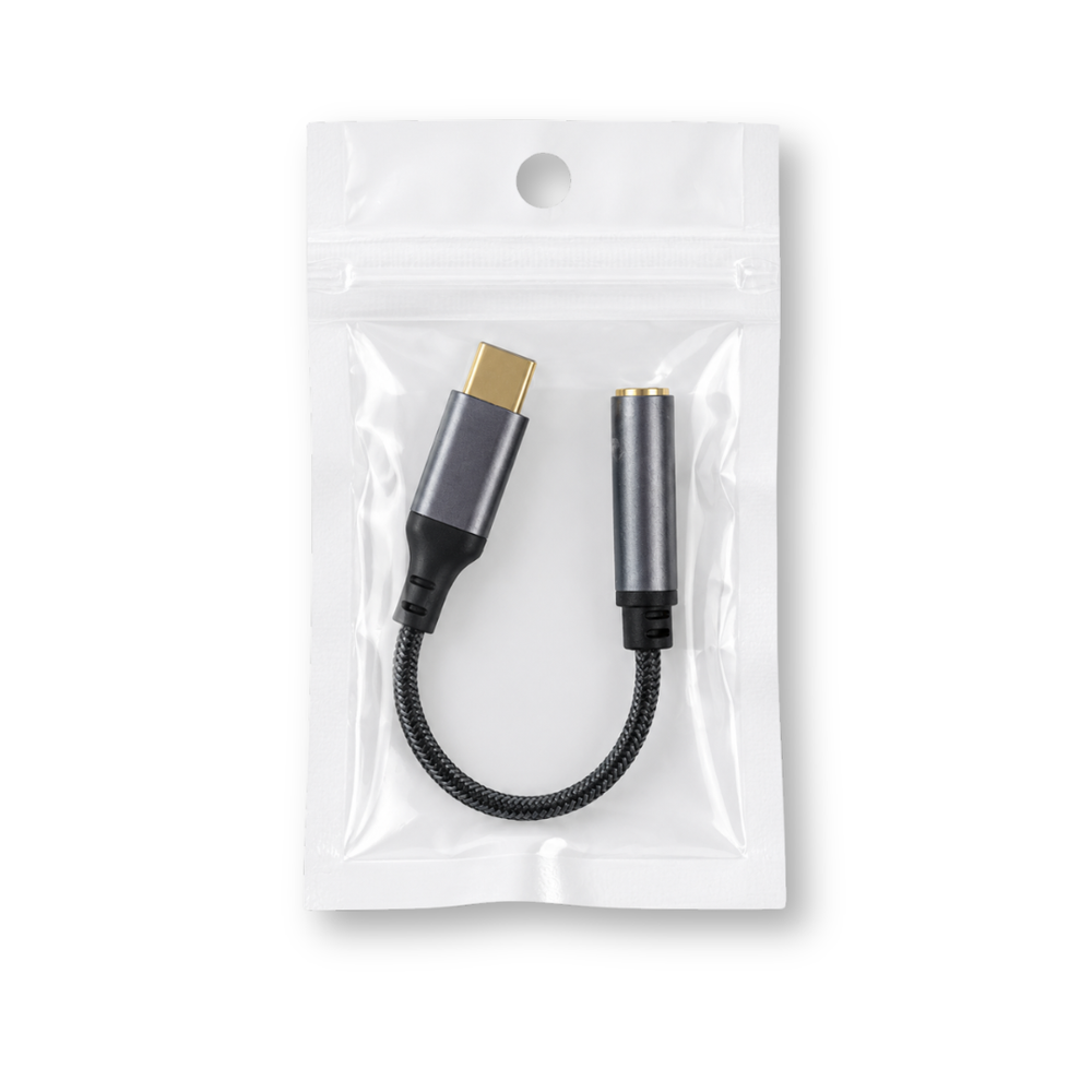 USB-C to 3.5mm audio adapter in clear packaging on white background.