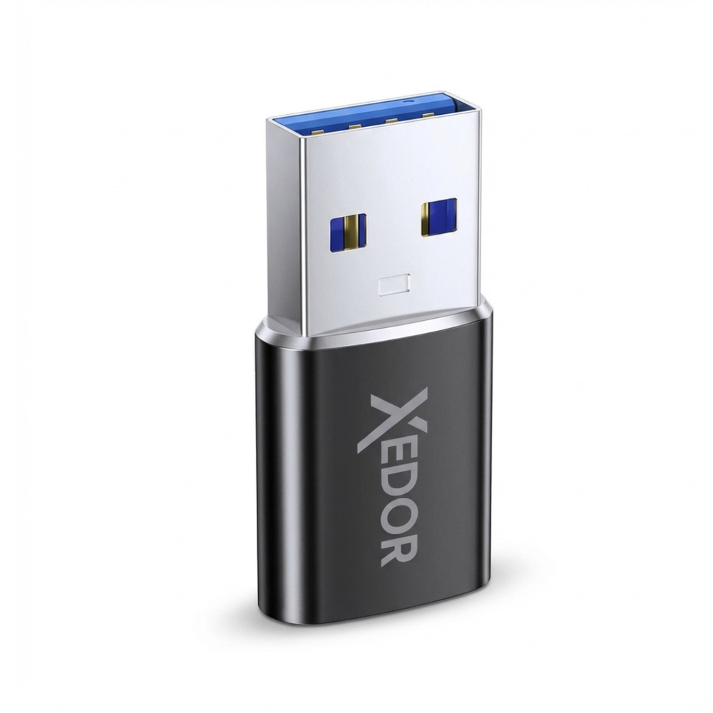 A black USB flash drive with a silver connector and blue accents. The brand name XEDOR is visible.