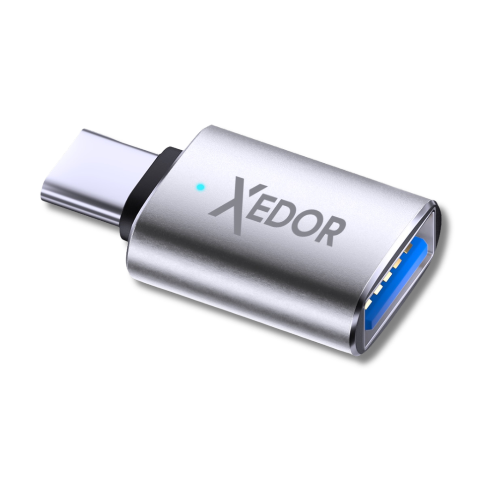 A silver USB-C to USB-A adapter with XEDOR logo and blue LED.