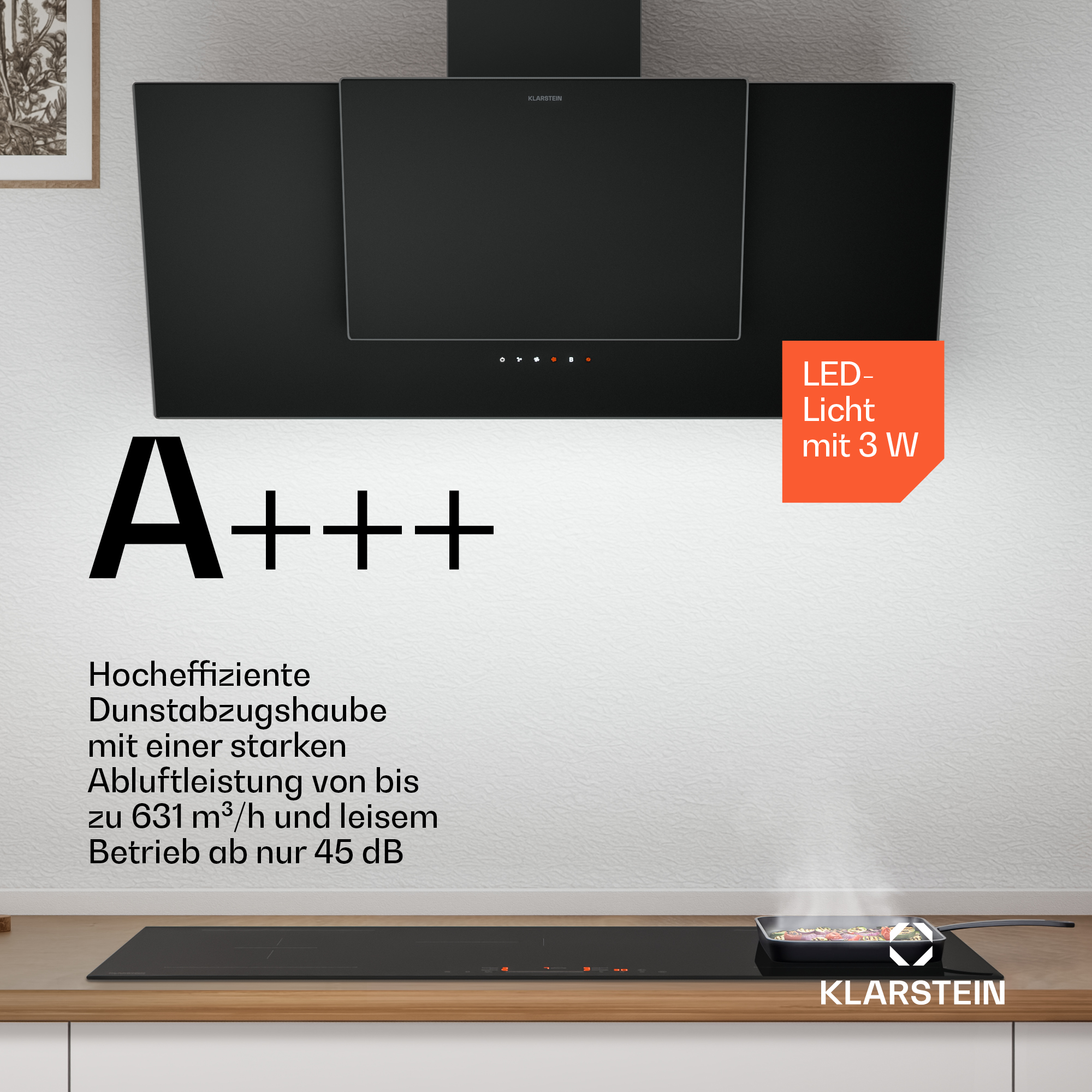 Schwarze Dunstabzugshaube über Kochfeld mit Gemüsepfanne. Energieeffizienz A+++.