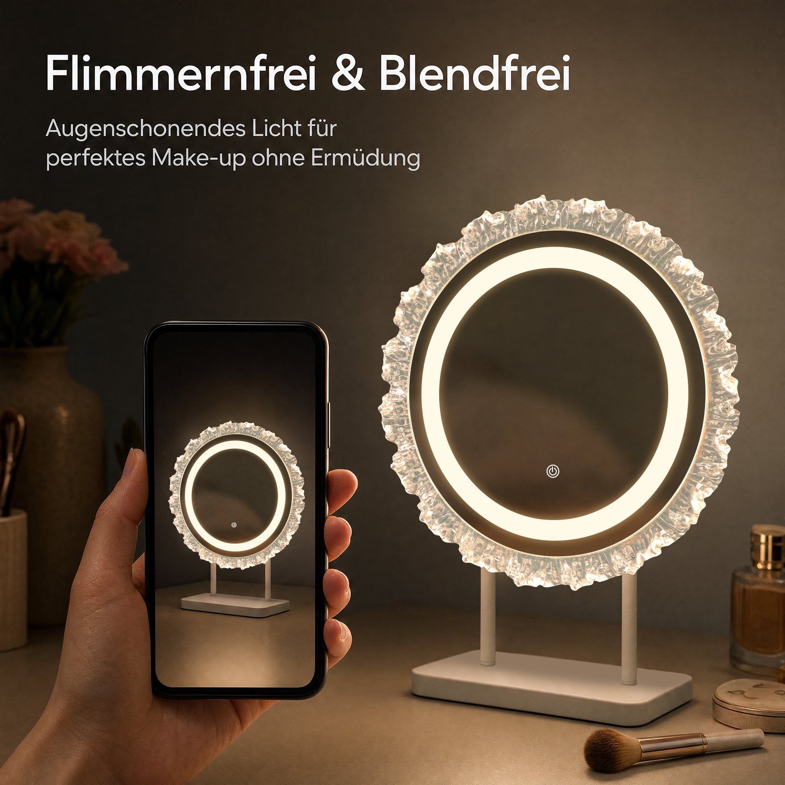 Se muestra un espejo de maquillaje iluminado con marco de cristal junto a un teléfono que muestra el mismo espejo.