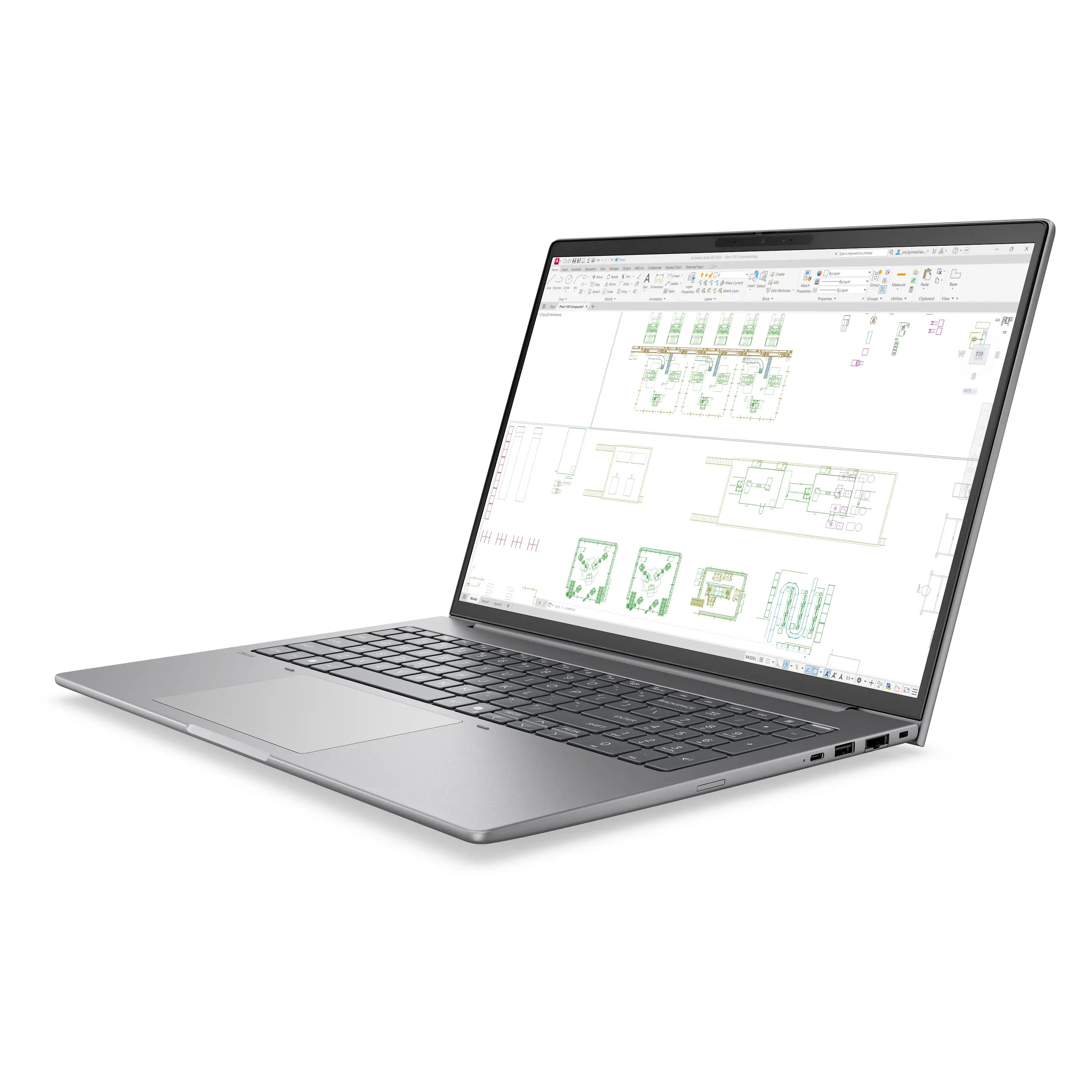Un laptop argentato mostra un progetto sullo schermo, con strumenti in alto.