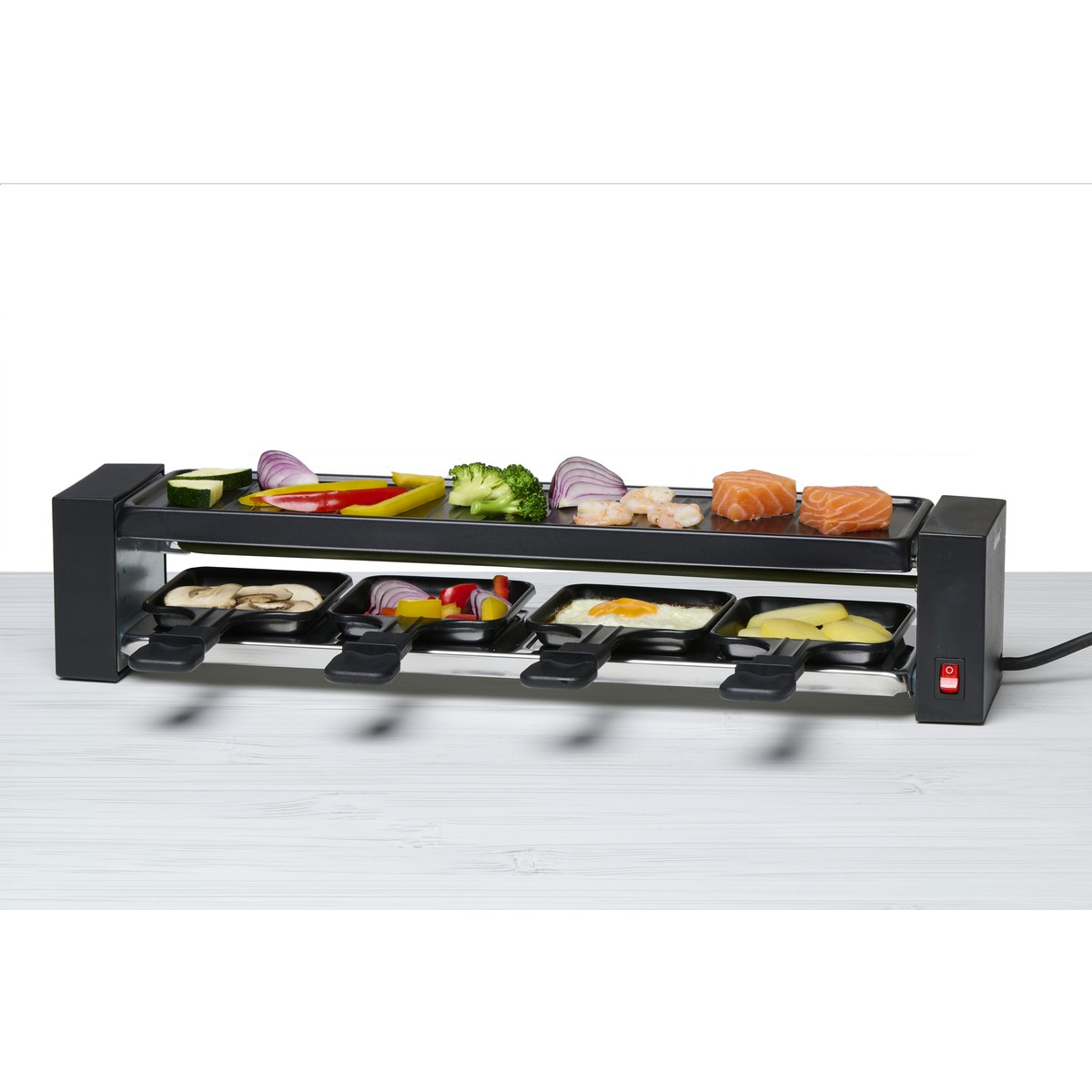 A raclette grill featuring vegetables, shrimp, salmon, mushrooms, and egg.