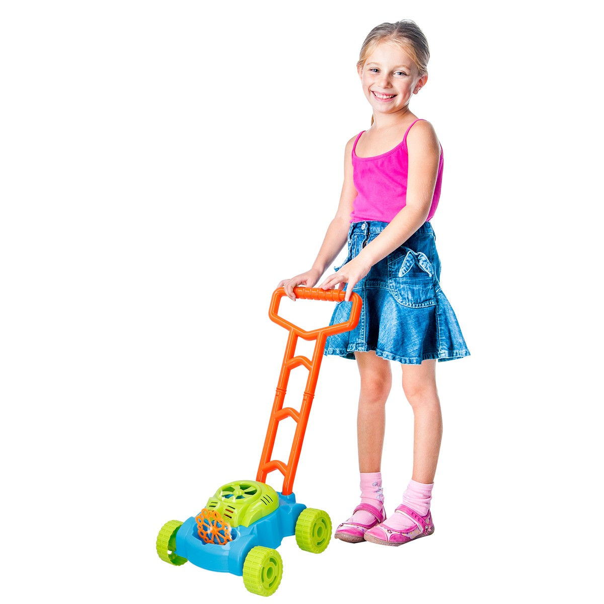 A girl pushes a colorful toy lawnmower with an orange handle.
