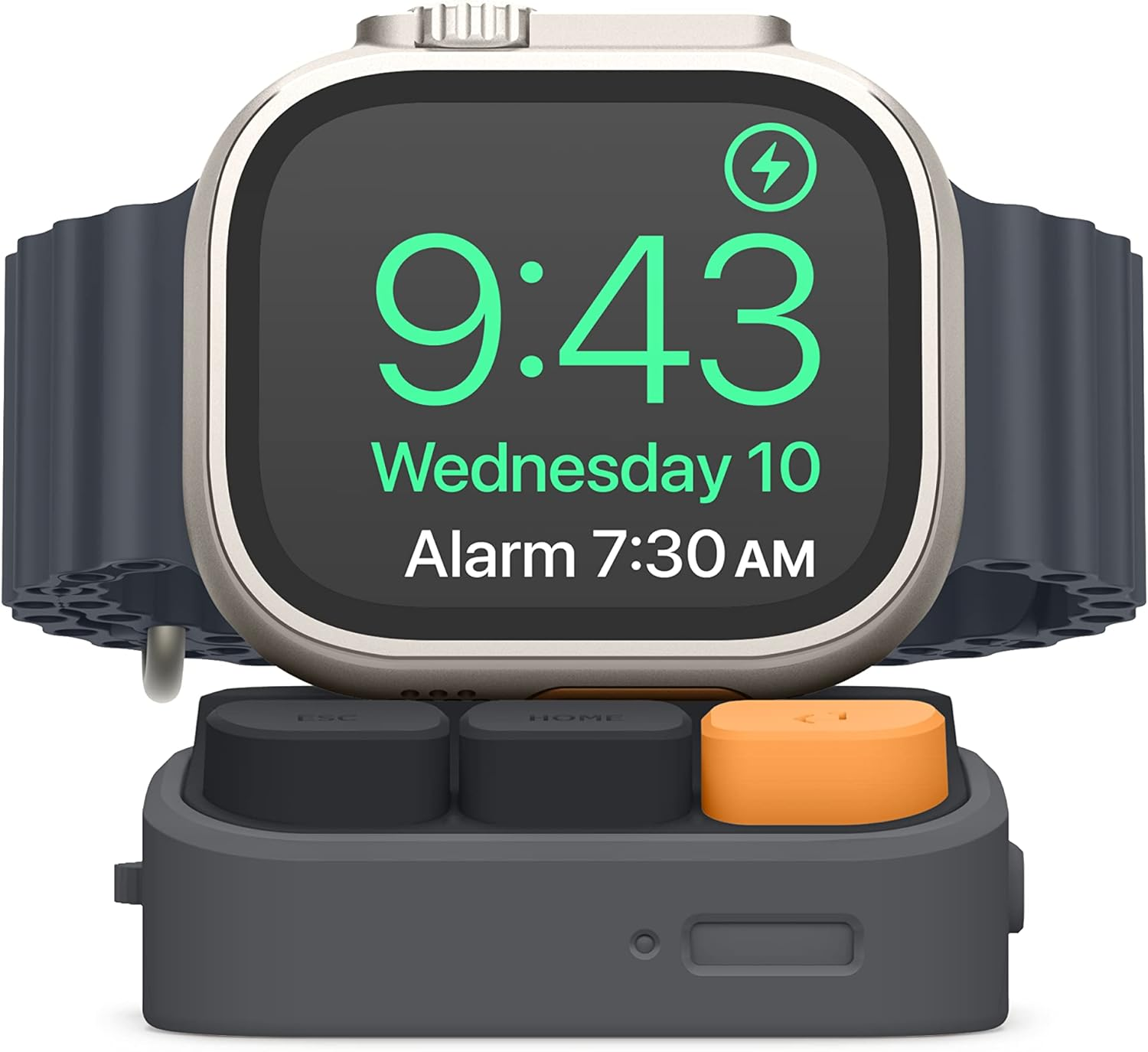 Szary smartwatch z srebrną obudową na stacji ładującej. Zegarek pokazuje 9:43.
