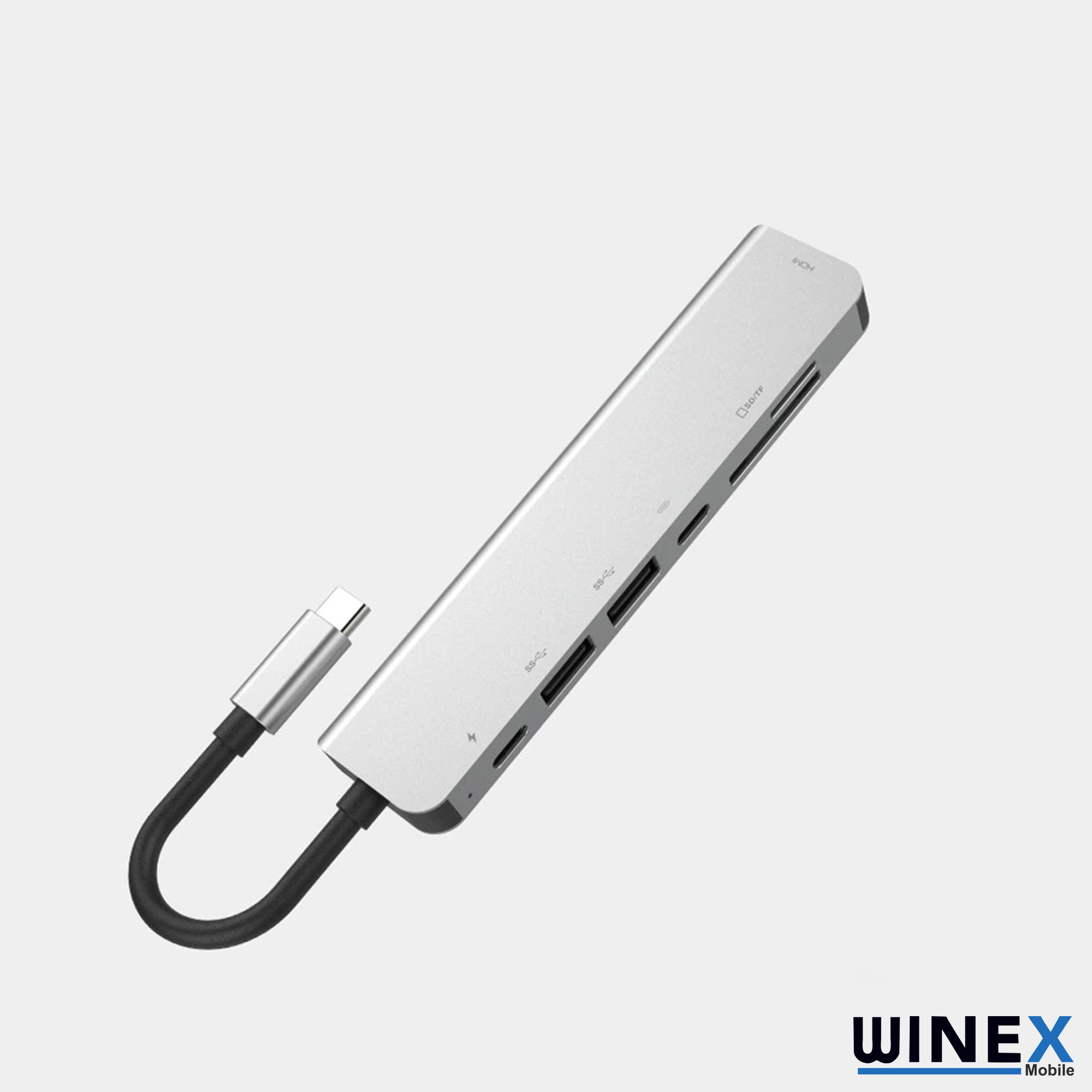 Gümüş renkli USB-C hub, HDMI, SD/TF ve USB bağlantı noktalarına sahip.