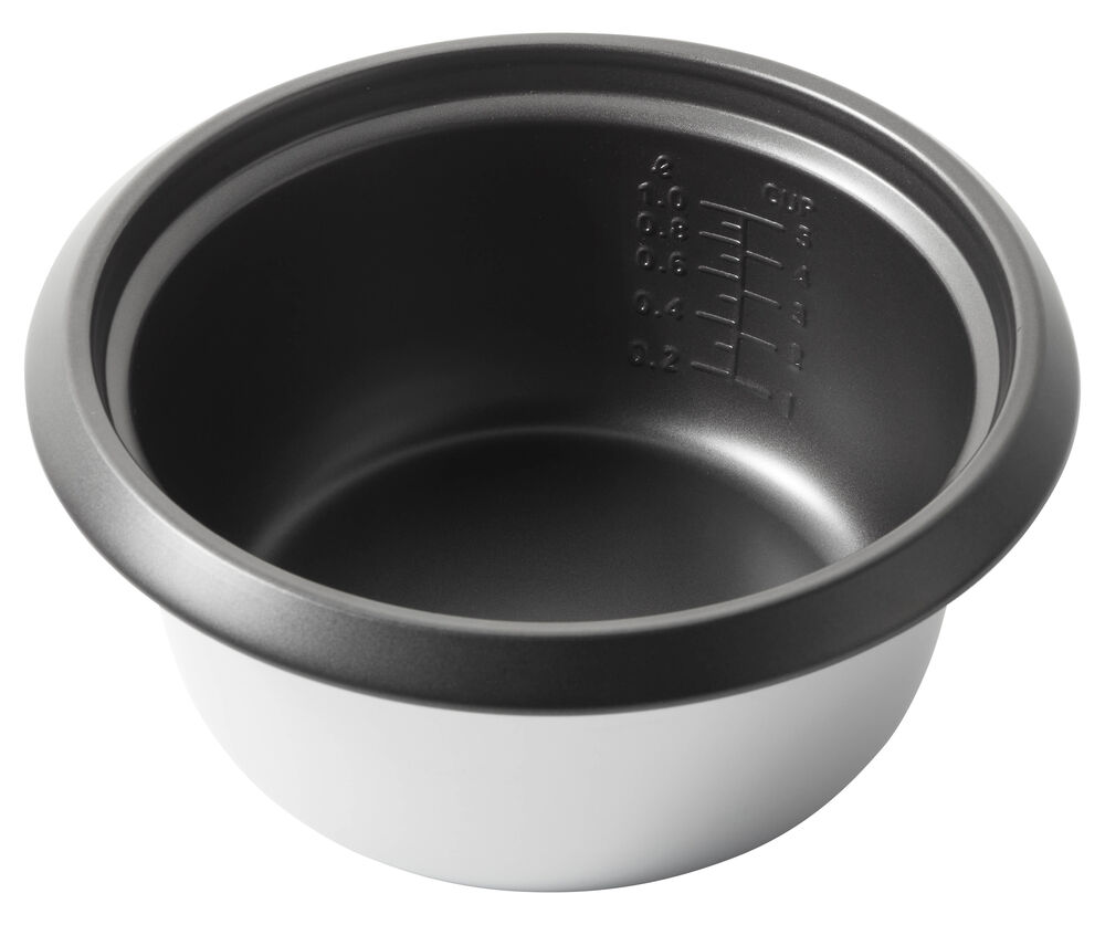 An empty metal rice cooker pot with measurement markings, black inside, white outside.