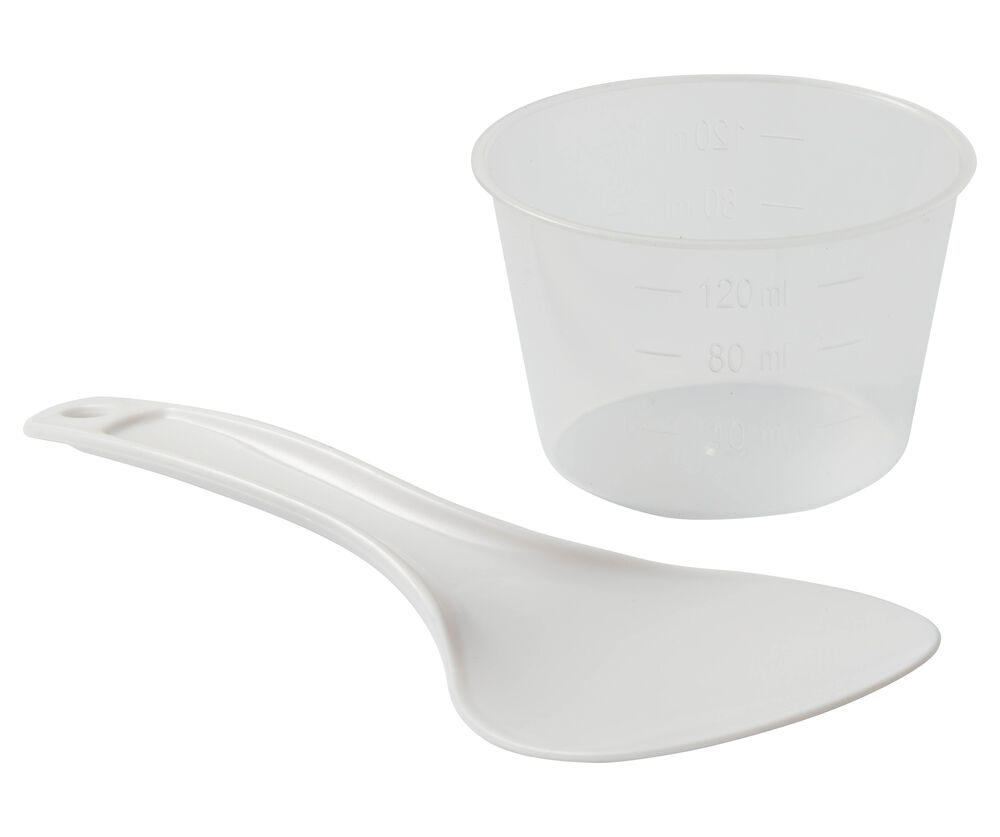 Une spatule à riz blanche et une tasse à mesurer transparente avec marques.