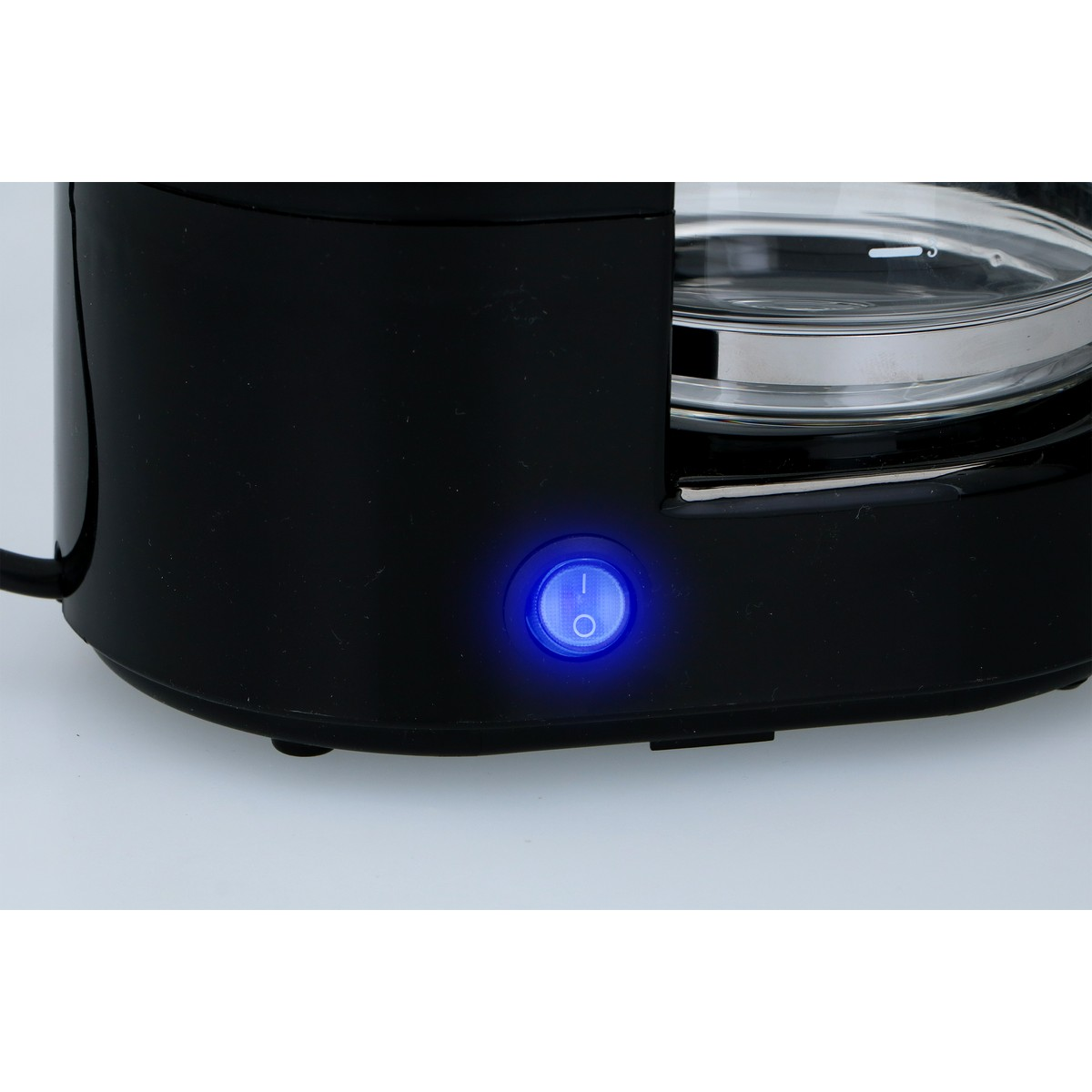Black kettle with illuminated blue switch and glass carafe.