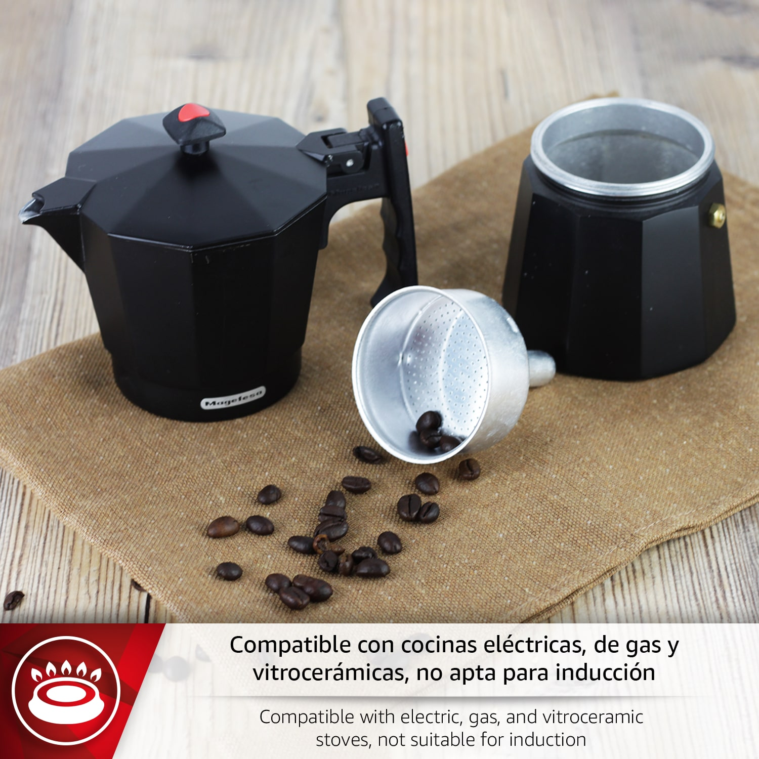 Cafetera Moka negra con granos de café sobre tela de lino.