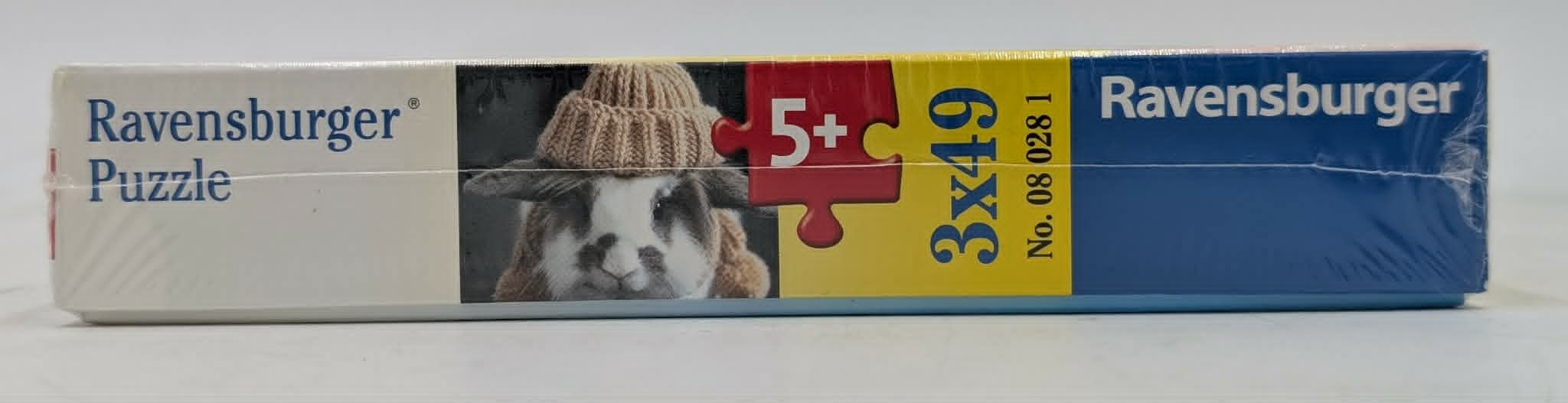 Ravensburger Puzzle mit einem Kaninchen, das eine Strickmütze trägt.