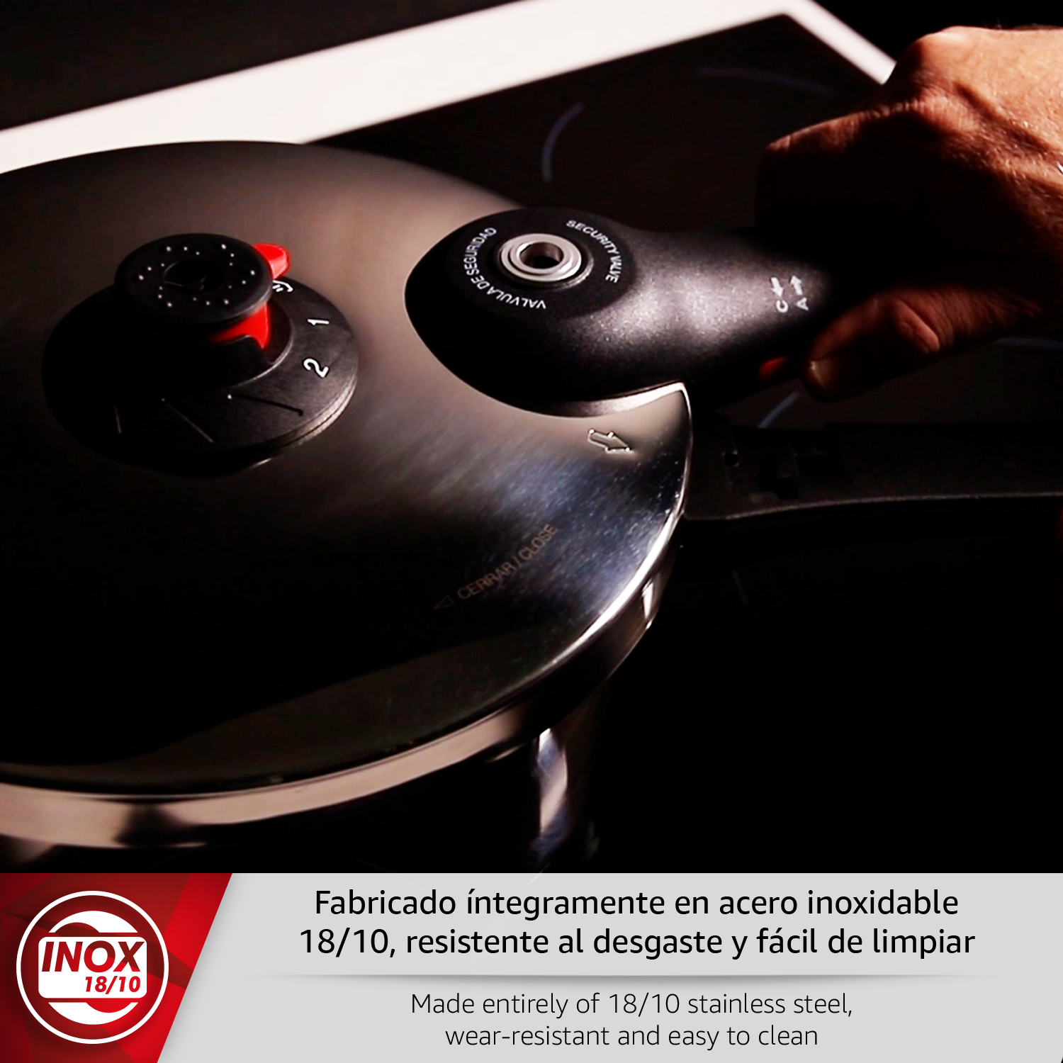 Olla a presión de acero inoxidable con válvula de seguridad y asas.