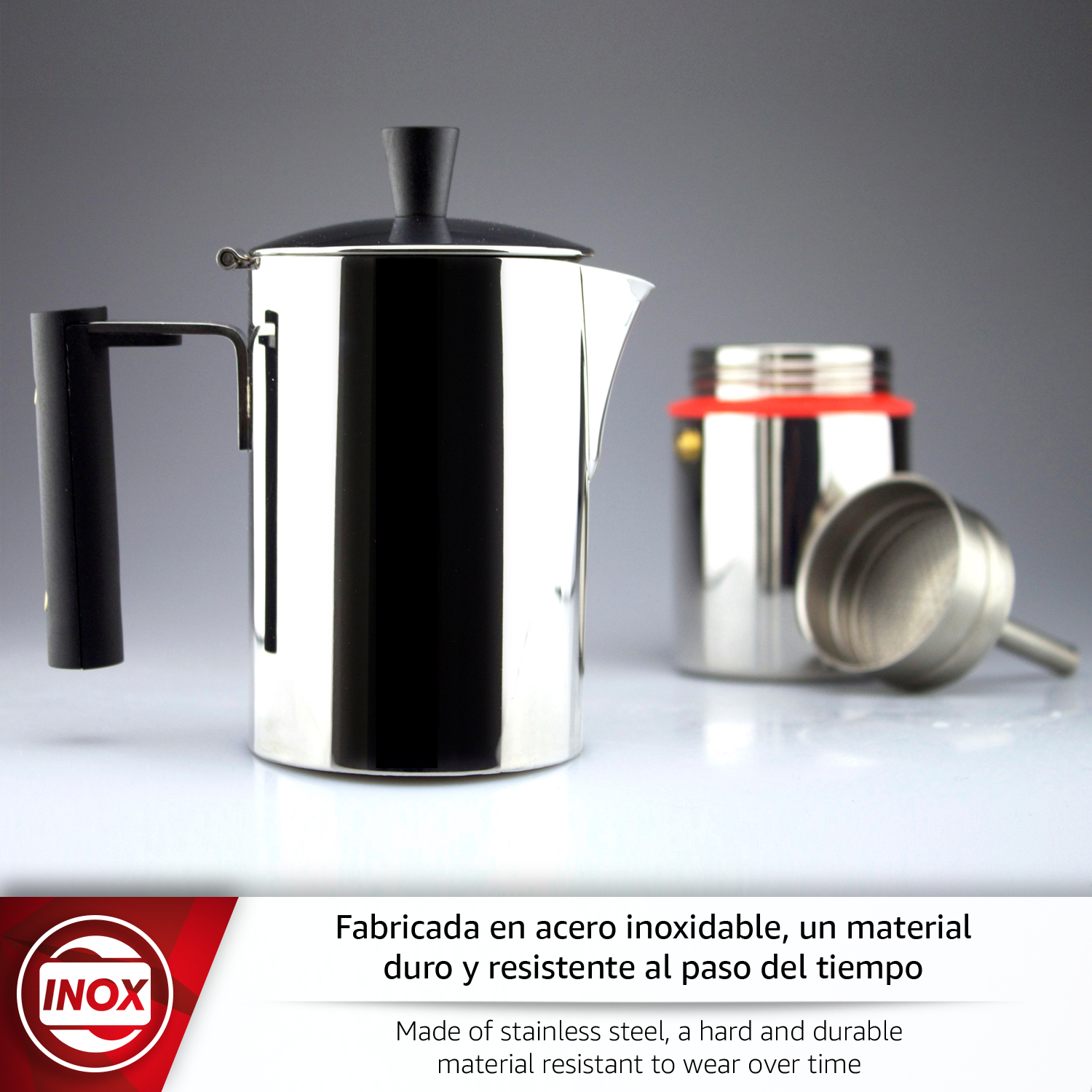 Olla de acero inoxidable con asa y tapa negras. Un recipiente al lado.