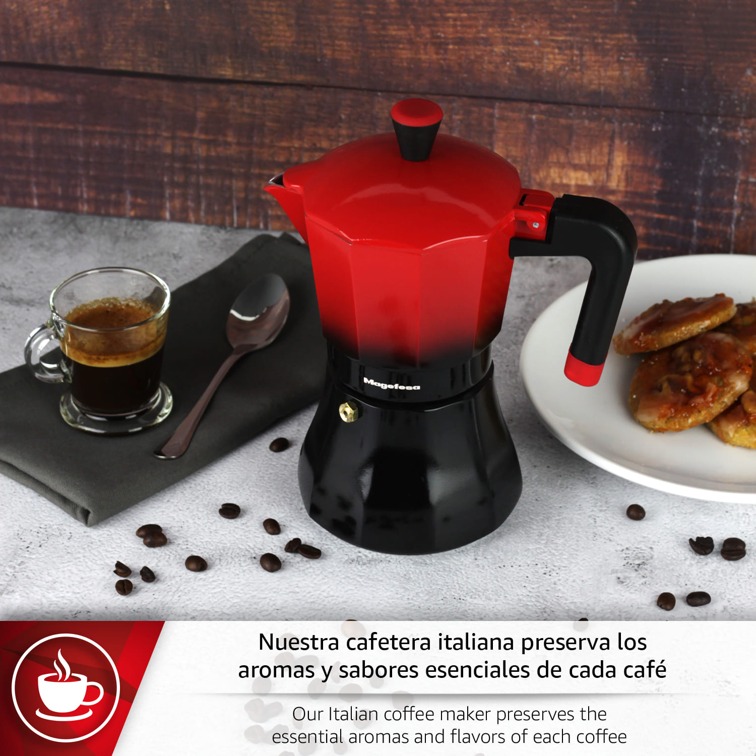 Cafetera roja y negra con taza de espresso, cuchara y granos de café.