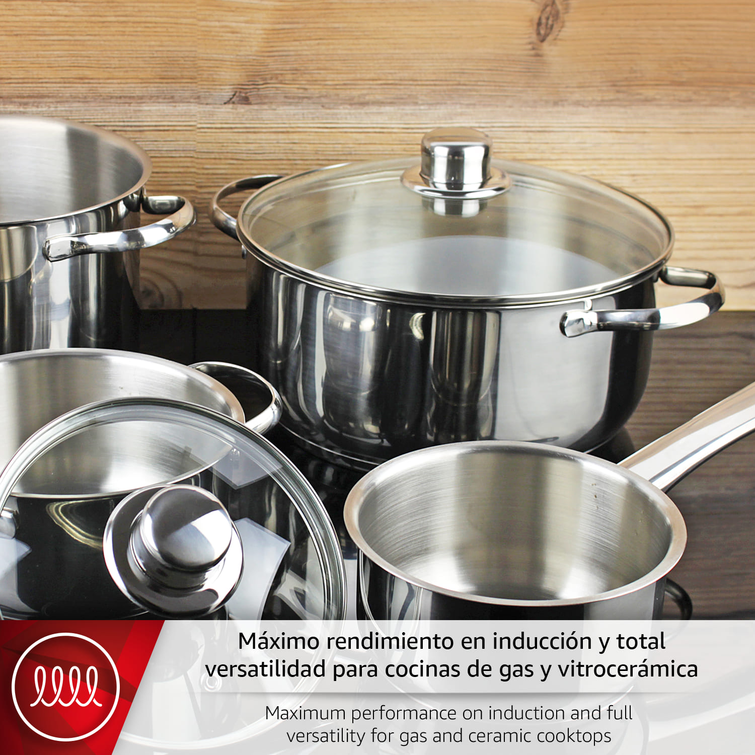 Ollas de acero inoxidable con tapas de cristal sobre vitrocerámica.