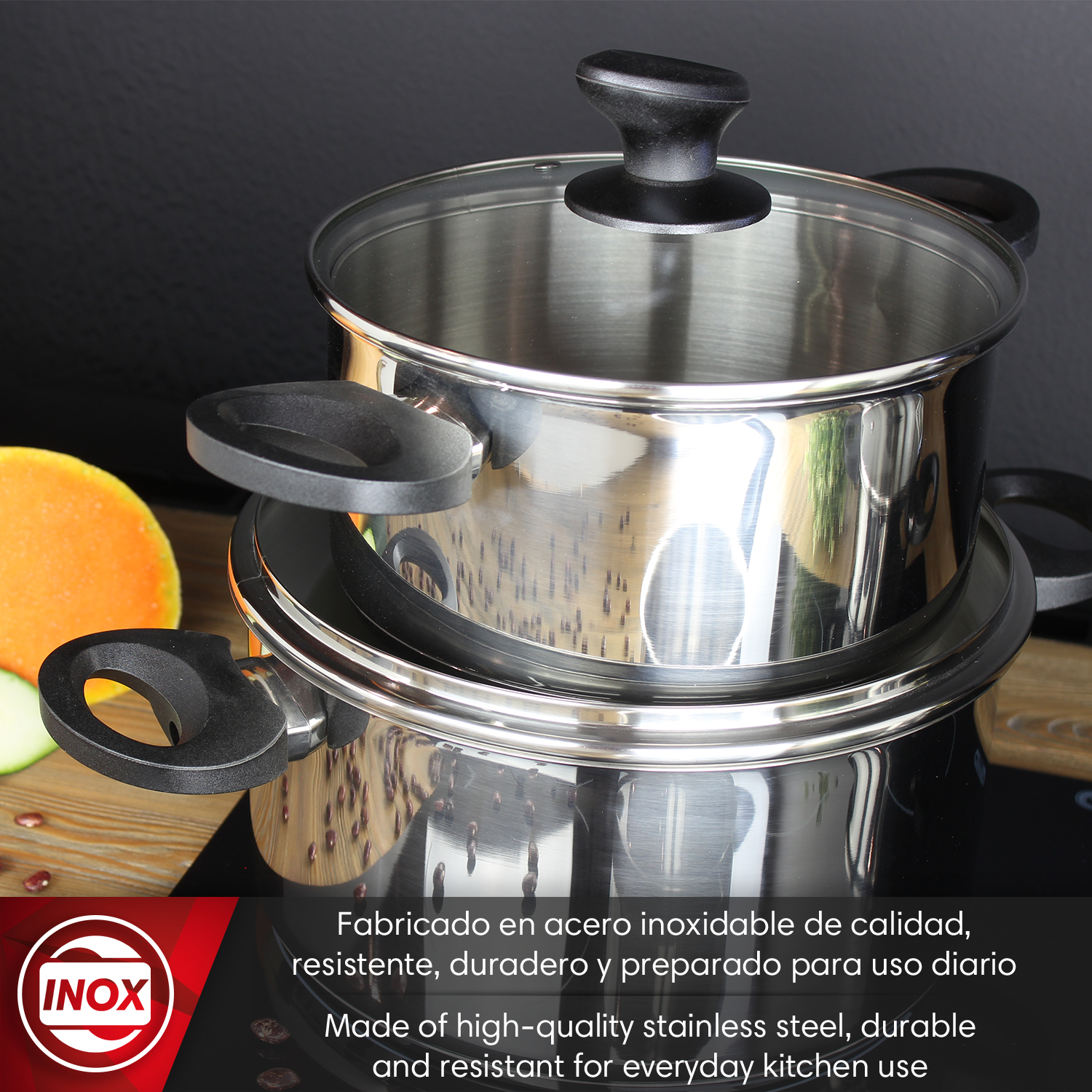 Dos ollas de acero inoxidable con tapa de cristal, junto a frutas y verduras.