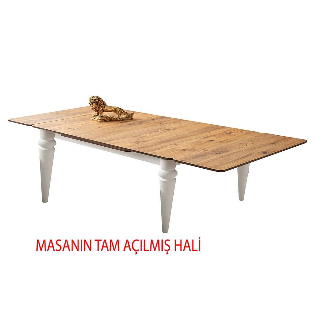 Beyaz ayaklı, üzerinde aslan figürü olan açılmış ahşap masa.