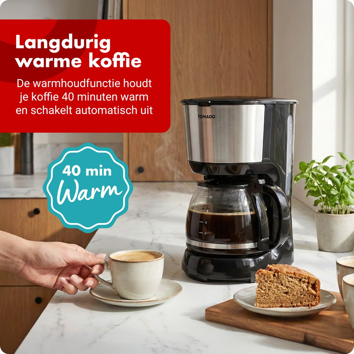 Coffee maker with carafe, cup and cake slice on a counter.