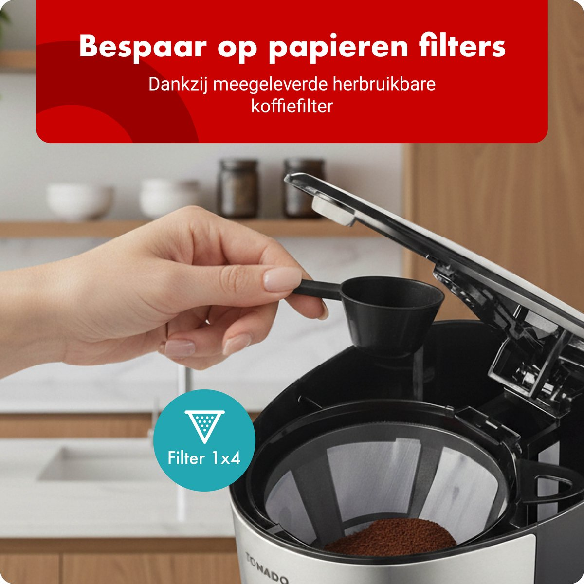 A hand adds coffee grounds to a reusable coffee filter in a coffee maker.