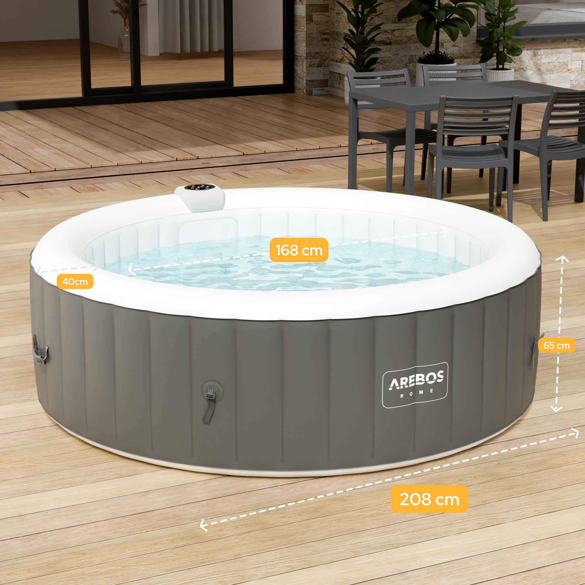 Aufblasbarer Whirlpool mit Steuergerät auf Holzboden, daneben ein Tisch mit Stühlen.