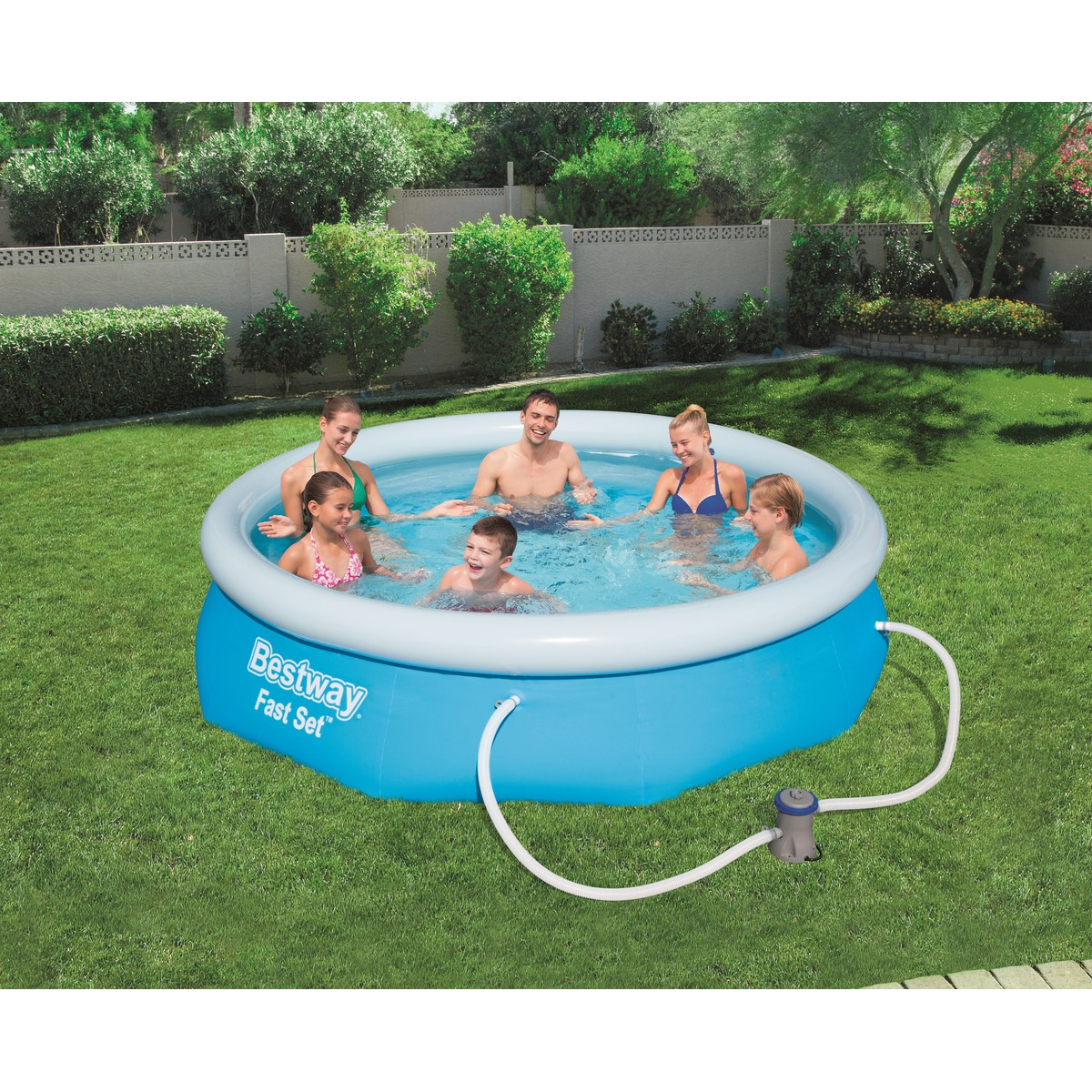 A family splashes in an inflatable pool in a backyard.