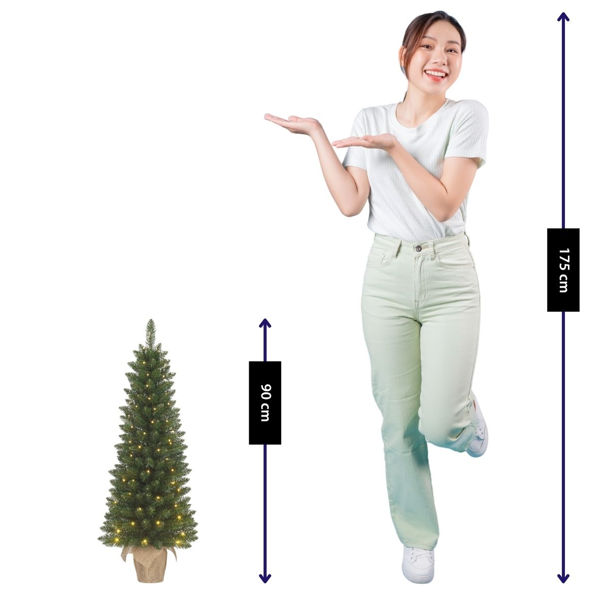 A woman (175 cm) stands next to a lit Christmas tree (90 cm).