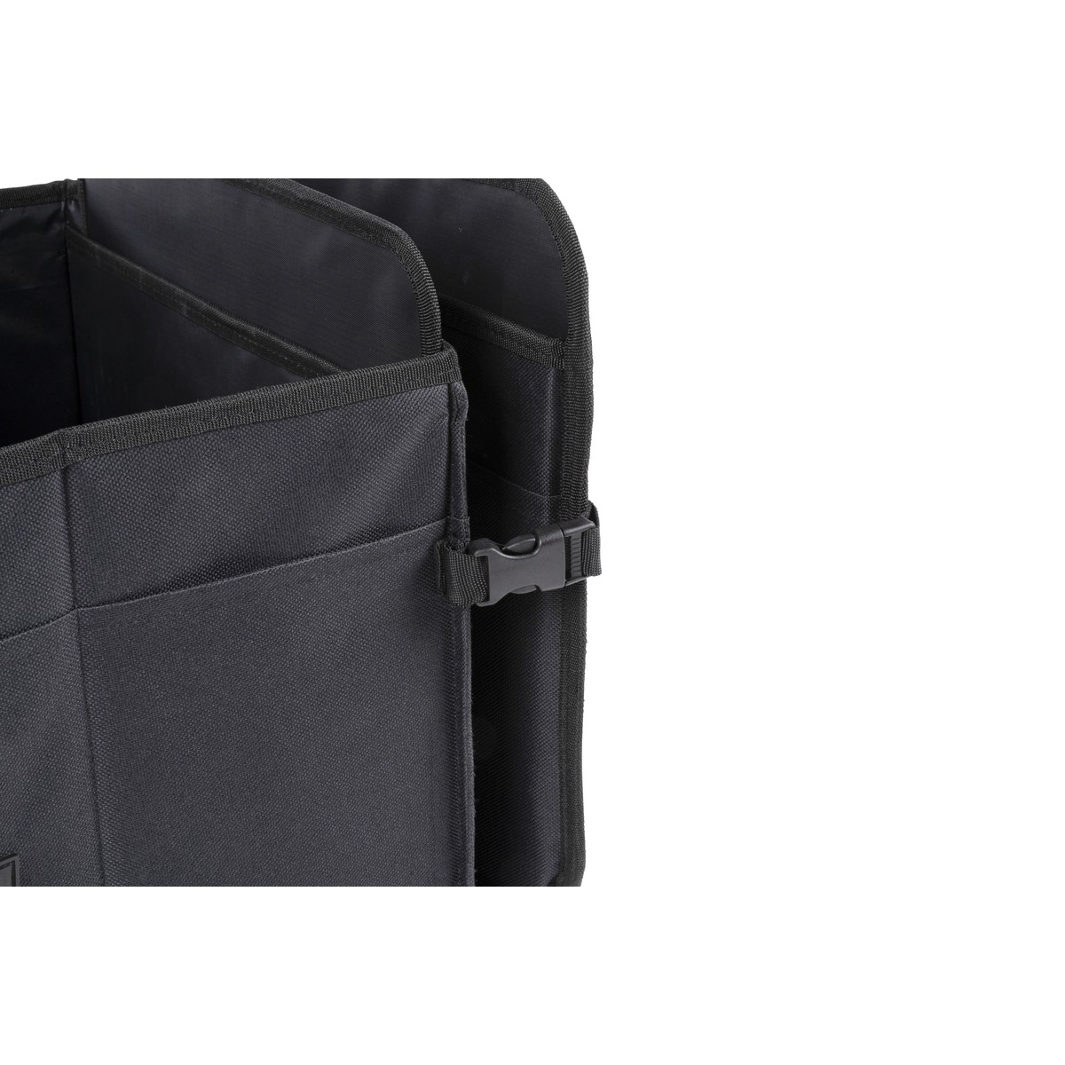 Black fabric organizer with multiple compartments and a buckle closure.