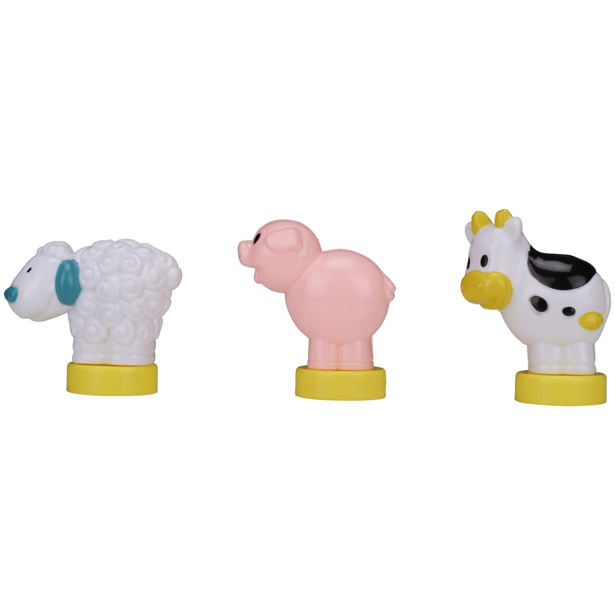 Figurines de mouton blanc, cochon rose et vache sur socles jaunes.
