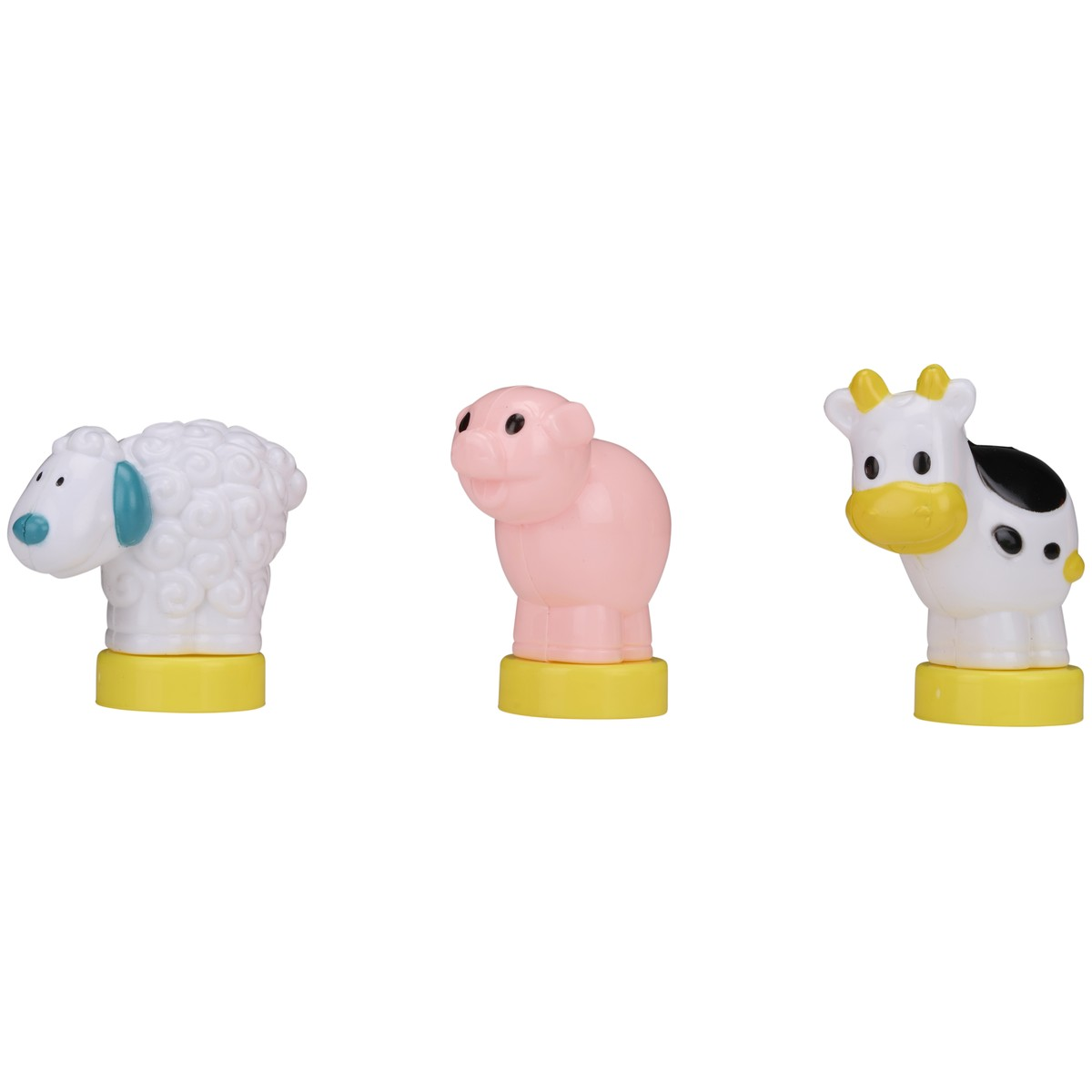 Trois jouets d'animaux de ferme en plastique : mouton blanc, cochon rose, vache.