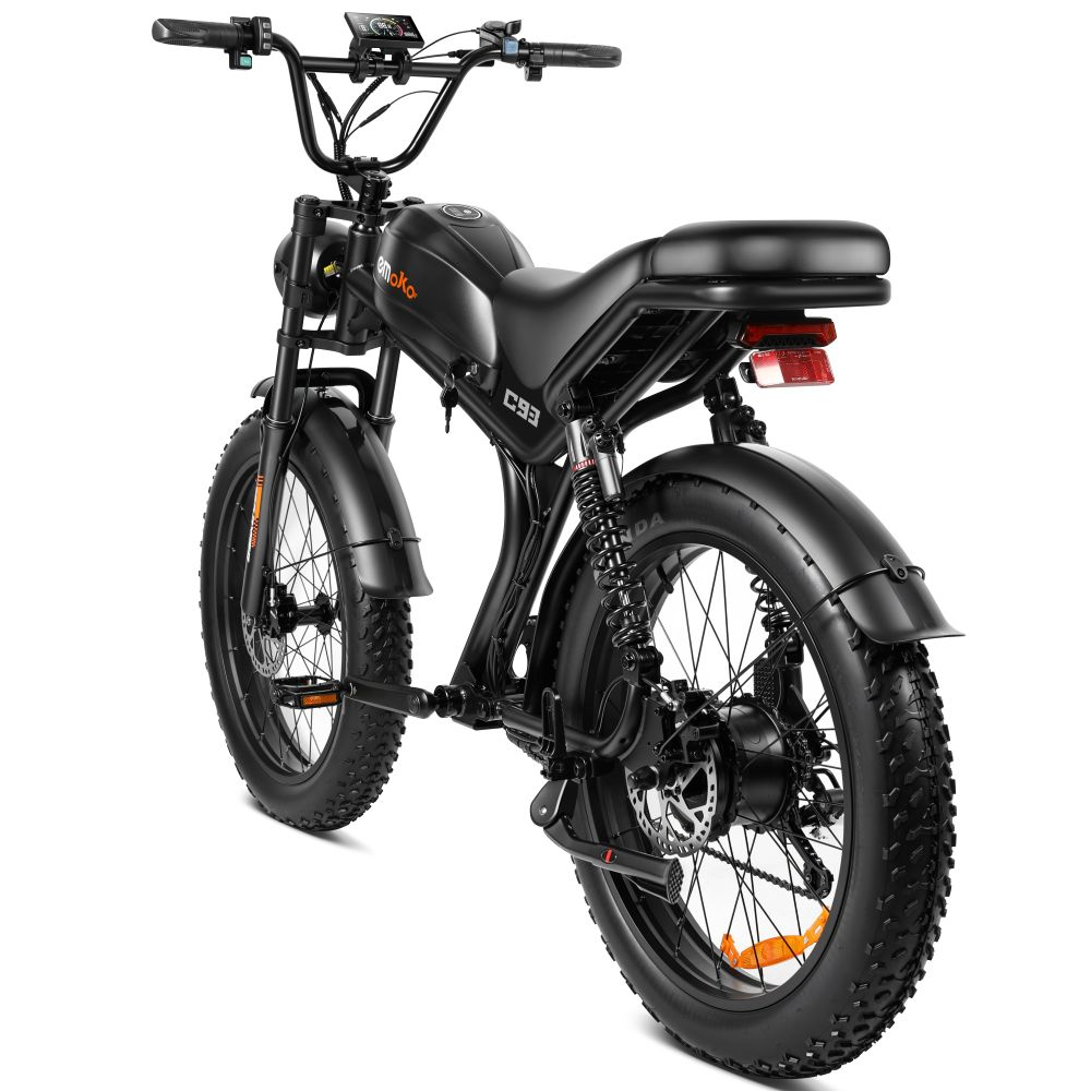 Bicicletta elettrica nera con pneumatici larghi, sospensioni e display digitale.