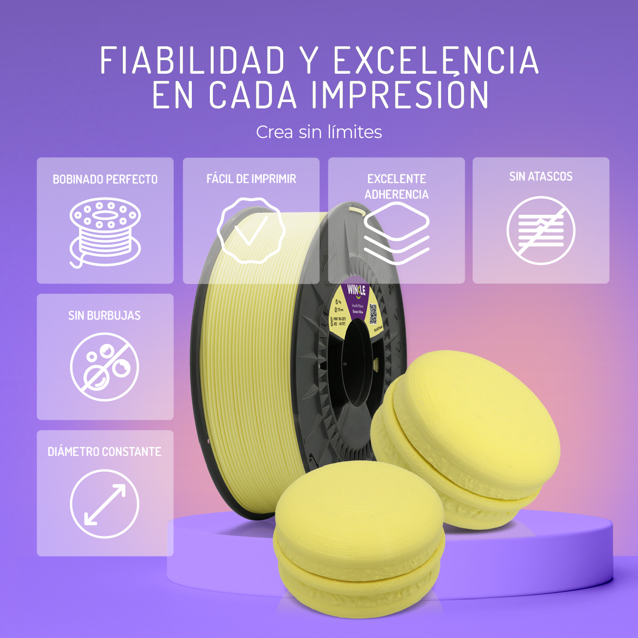 Un carrete de impresora 3D amarillo y dos objetos en forma de macaron.