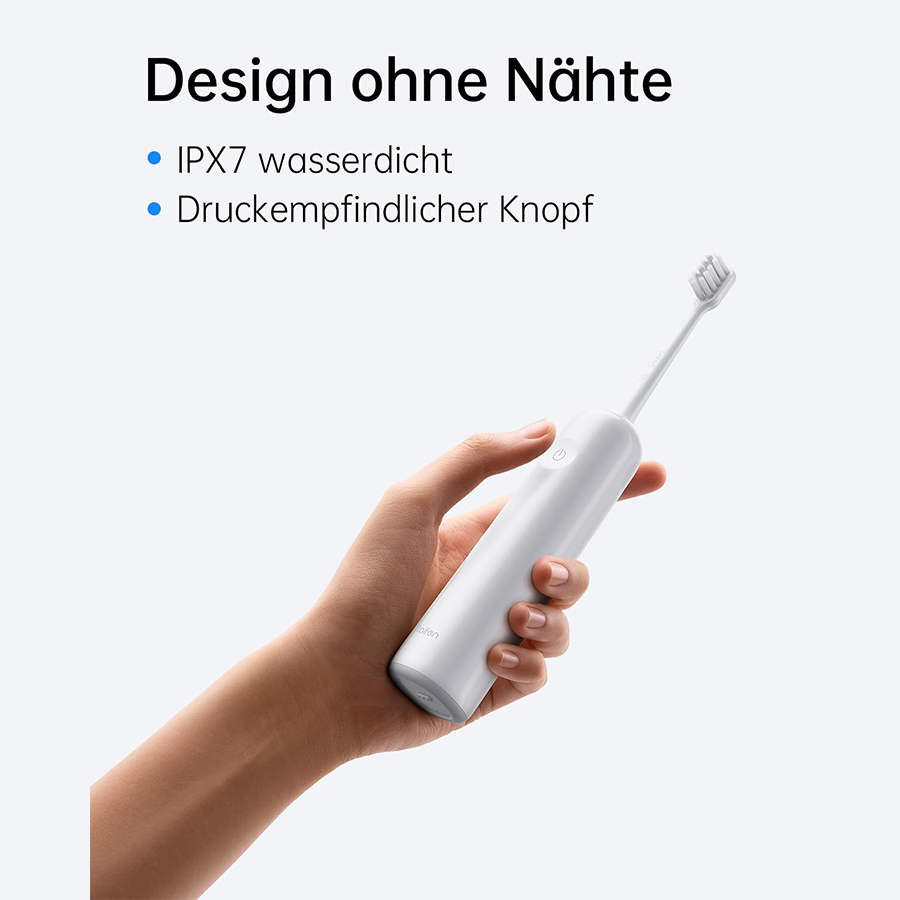 Eine Hand hält eine weiße elektrische Zahnbürste mit einem grauen Akzent.