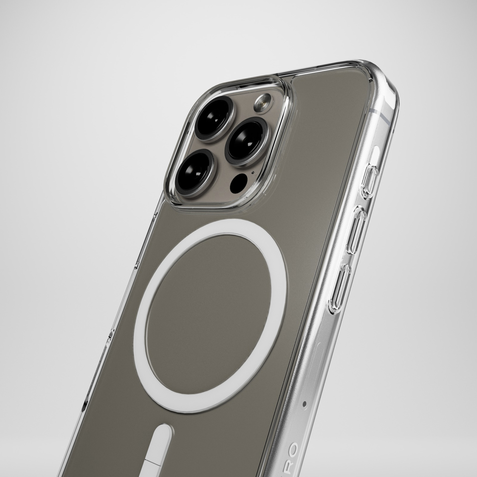 Custodia trasparente per telefono con anello MagSafe e lenti su sfondo grigio.