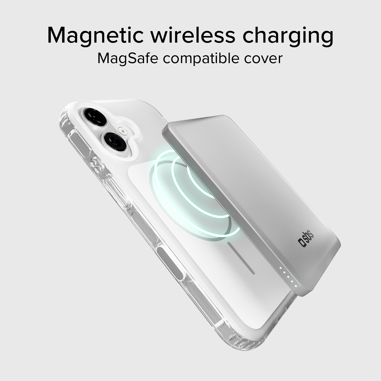 Un cargador MagSafe plateado carga un teléfono transparente.
