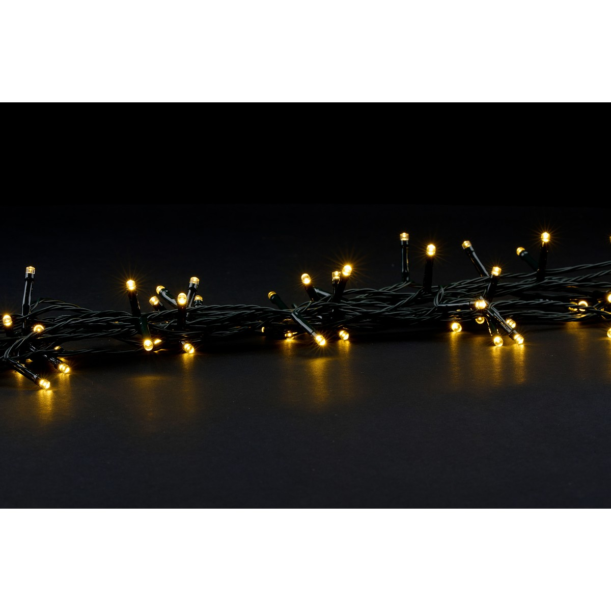 A string of warm white LED lights on a black background.