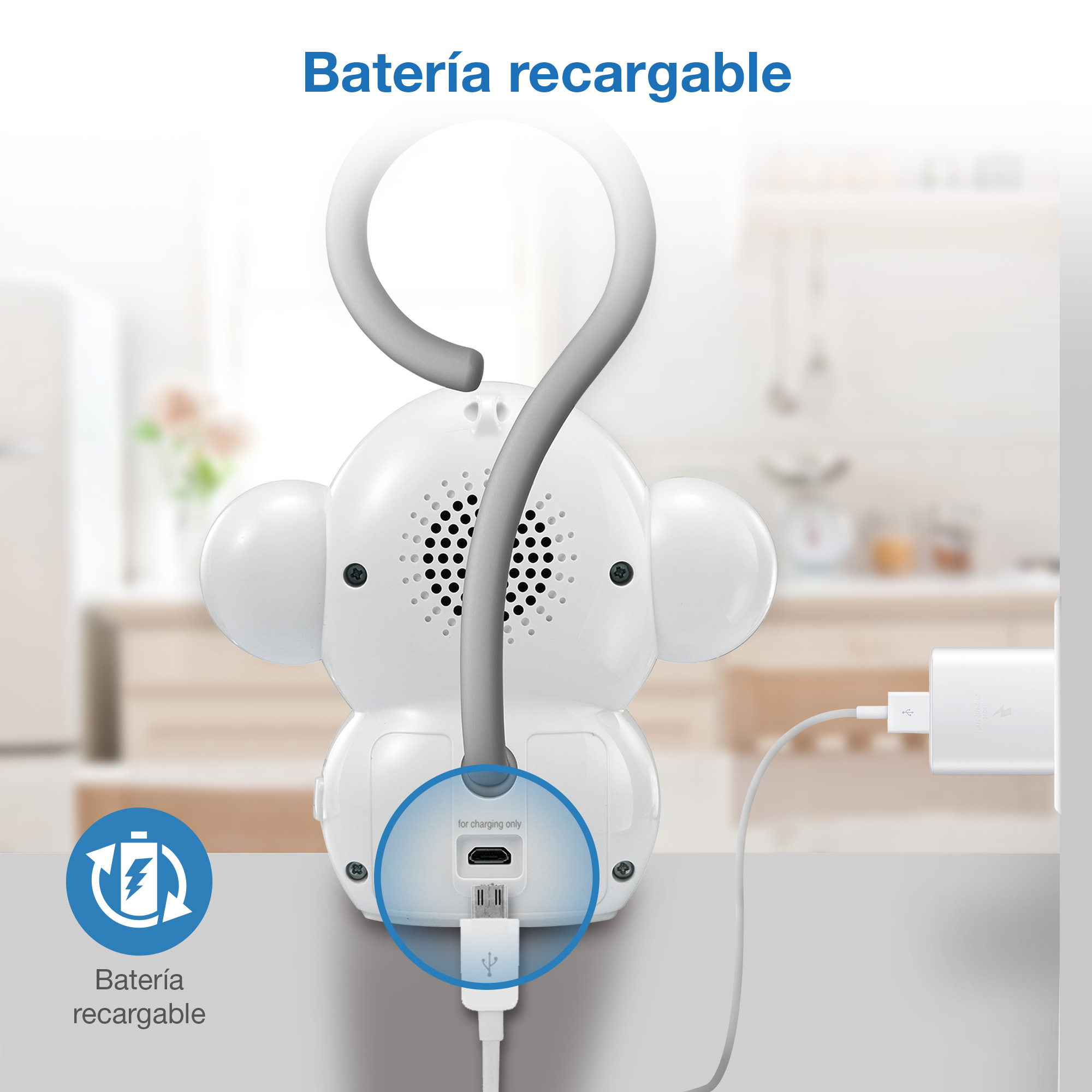 Una luz nocturna blanca con forma de mono se carga por USB. Un cargador está enchufado.