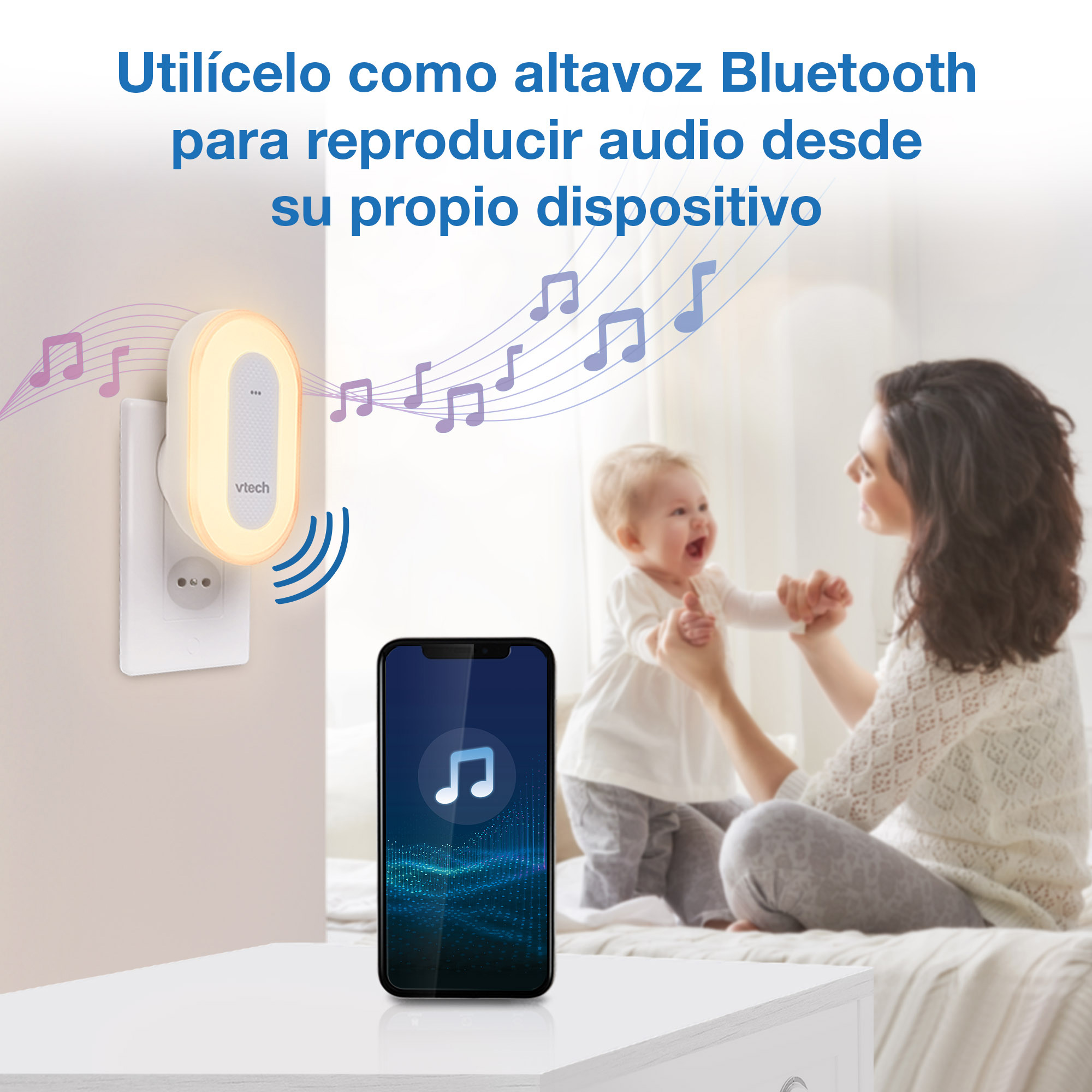 Una luz Vtech con notas musicales y un smartphone. Una madre sostiene a un bebé.