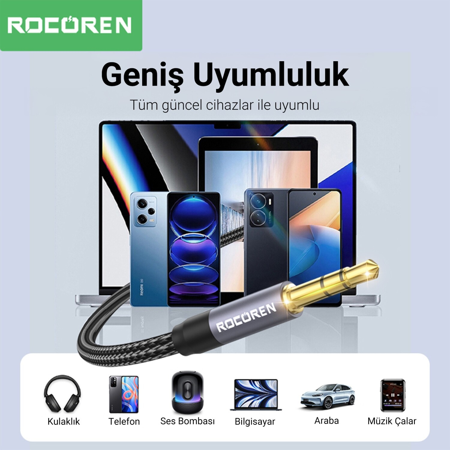 Altın konnektörlü bir ses kablosu çeşitli akıllı telefonların önünde.