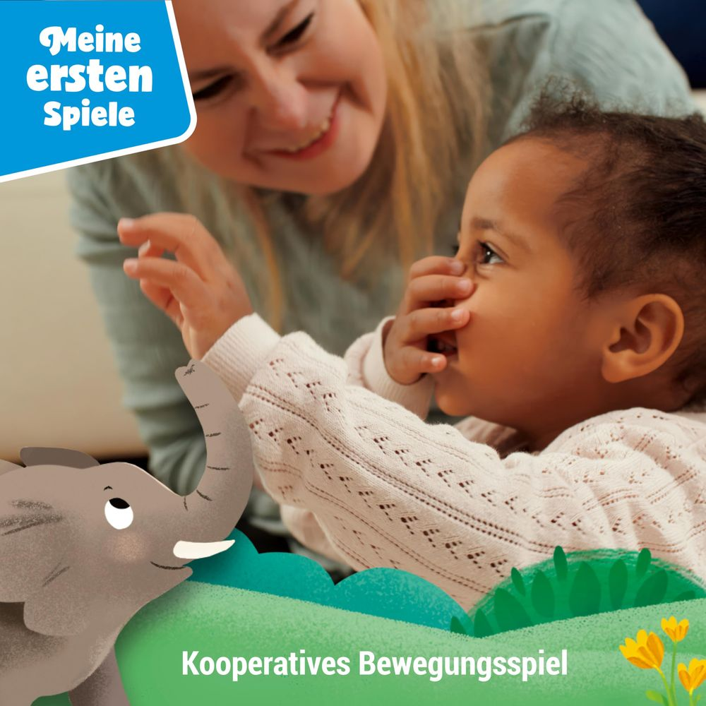 Una donna sorride a un bambino, con un elefante e fiori in primo piano.