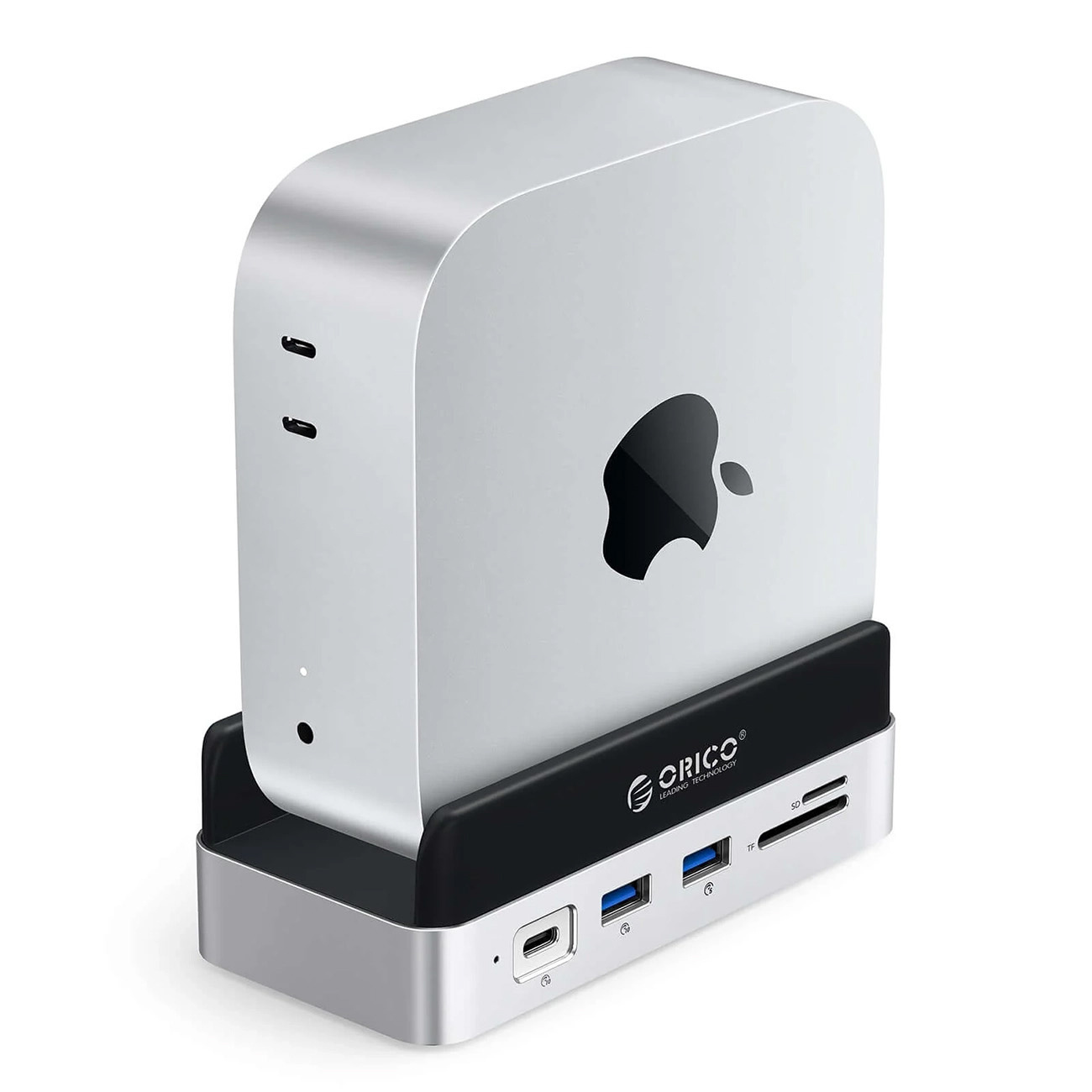 Srebrny Mac Mini stoi na czarno-srebrnej stacji dokującej z portami.