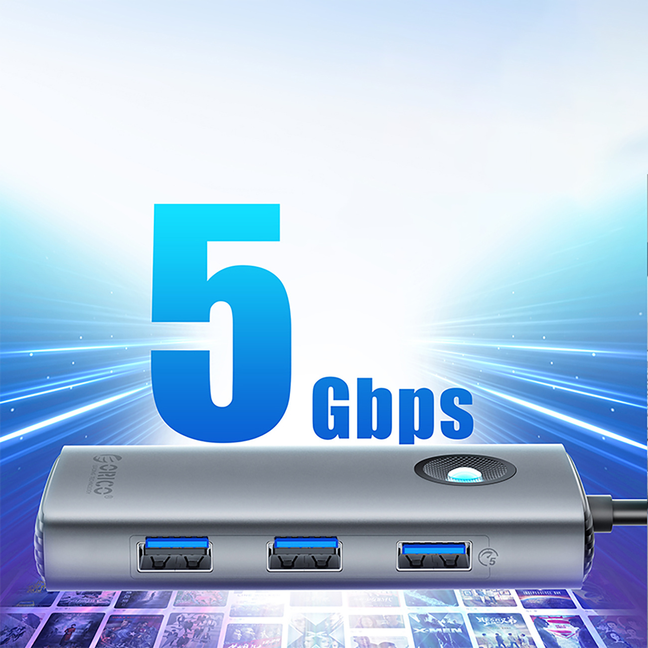 Srebrny hub USB z niebieskimi portami, wyświetla '5 Gbps' na niebieskim tle.