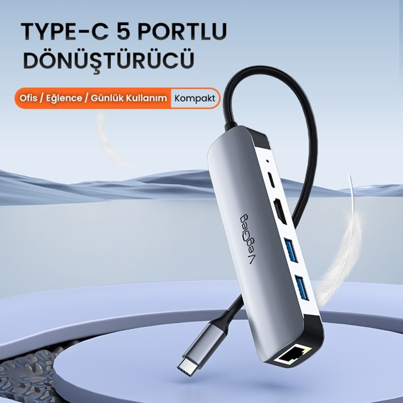 Gümüş renkli USB-C hub, HDMI ve USB-A dahil çoklu bağlantı noktaları.