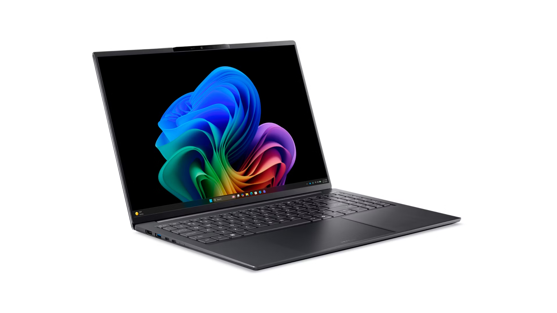 Un laptop scuro con uno sfondo colorato sullo schermo.