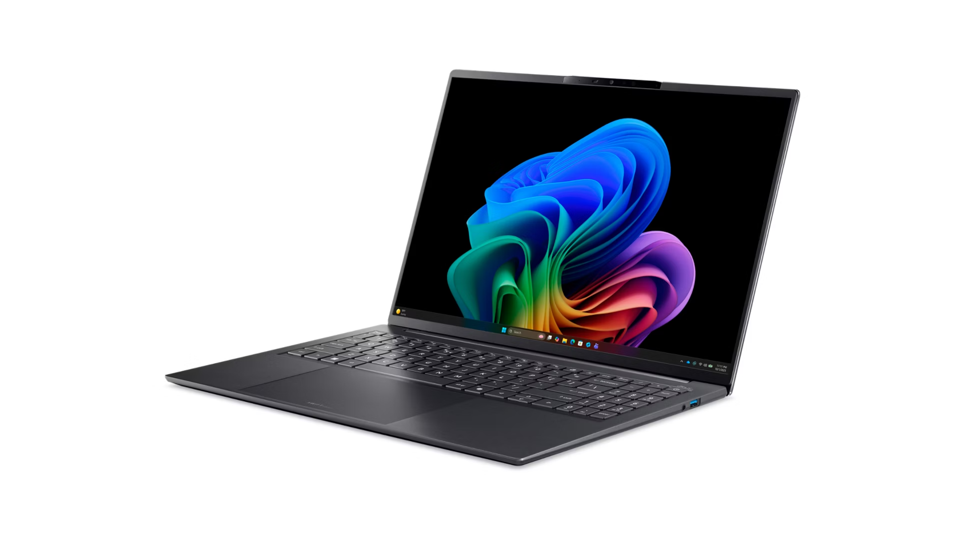 Un laptop scuro aperto che visualizza uno sfondo colorato sul suo schermo.