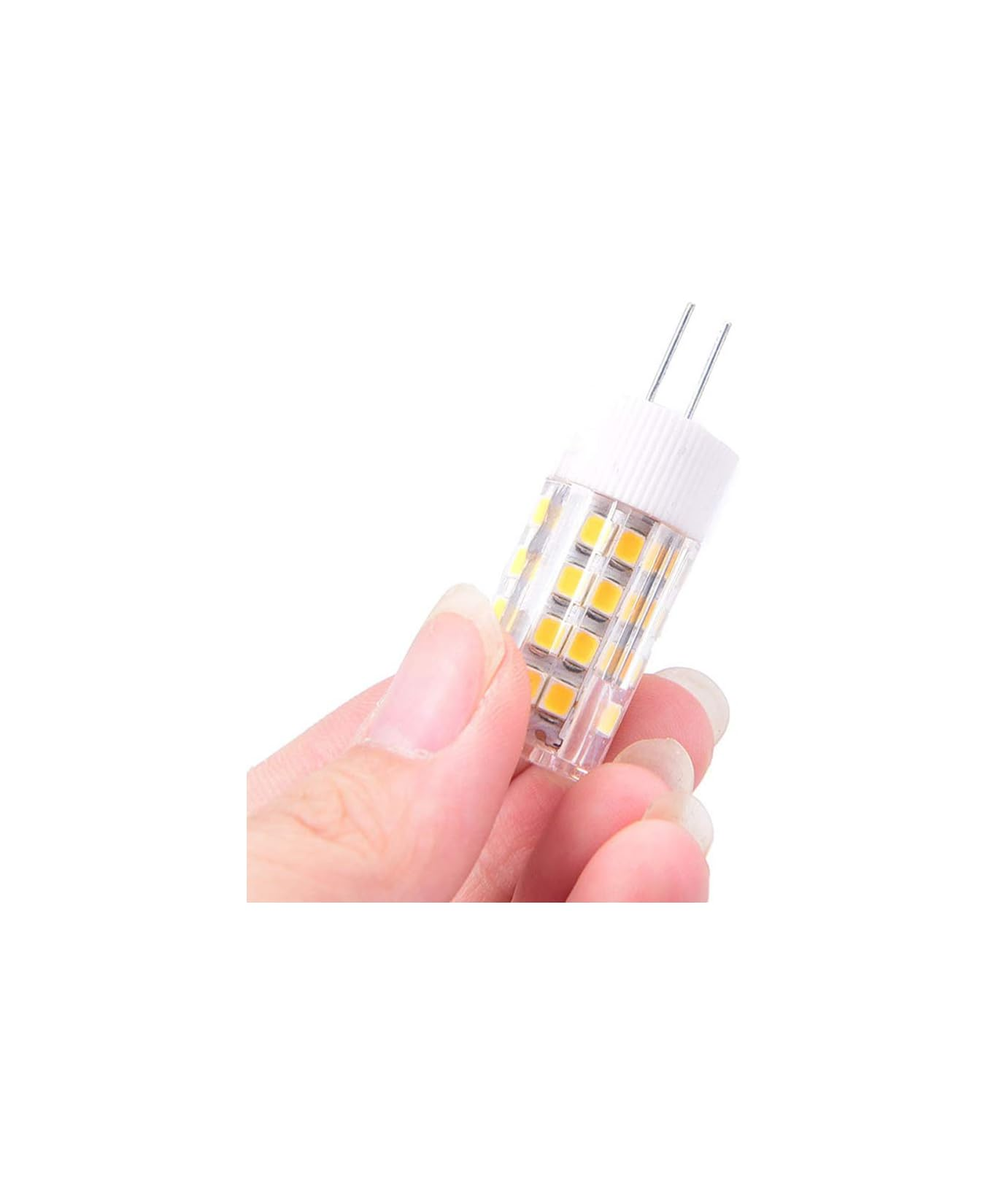 Eine Hand hält eine kleine LED-Lampe mit zwei Stiften.