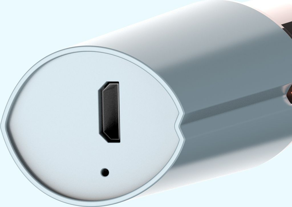 Nahaufnahme eines weißen Geräts mit einem HDMI-Anschluss und einem kleinen schwarzen Punkt.